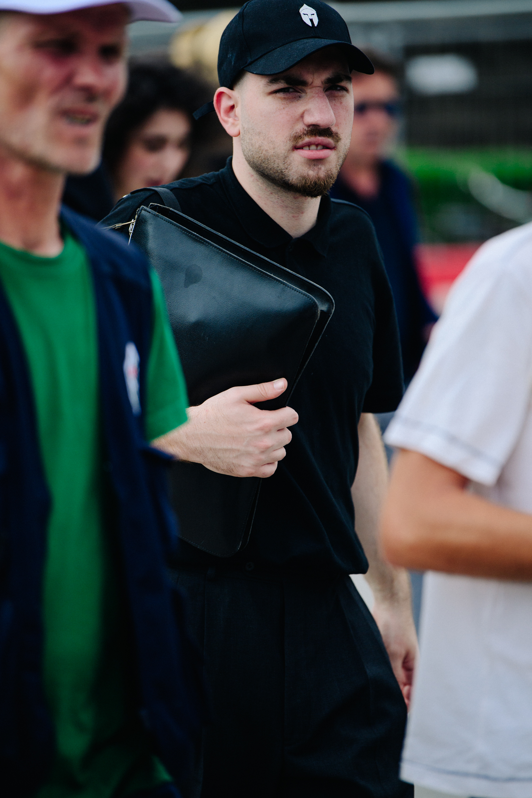 Man wearing black cap