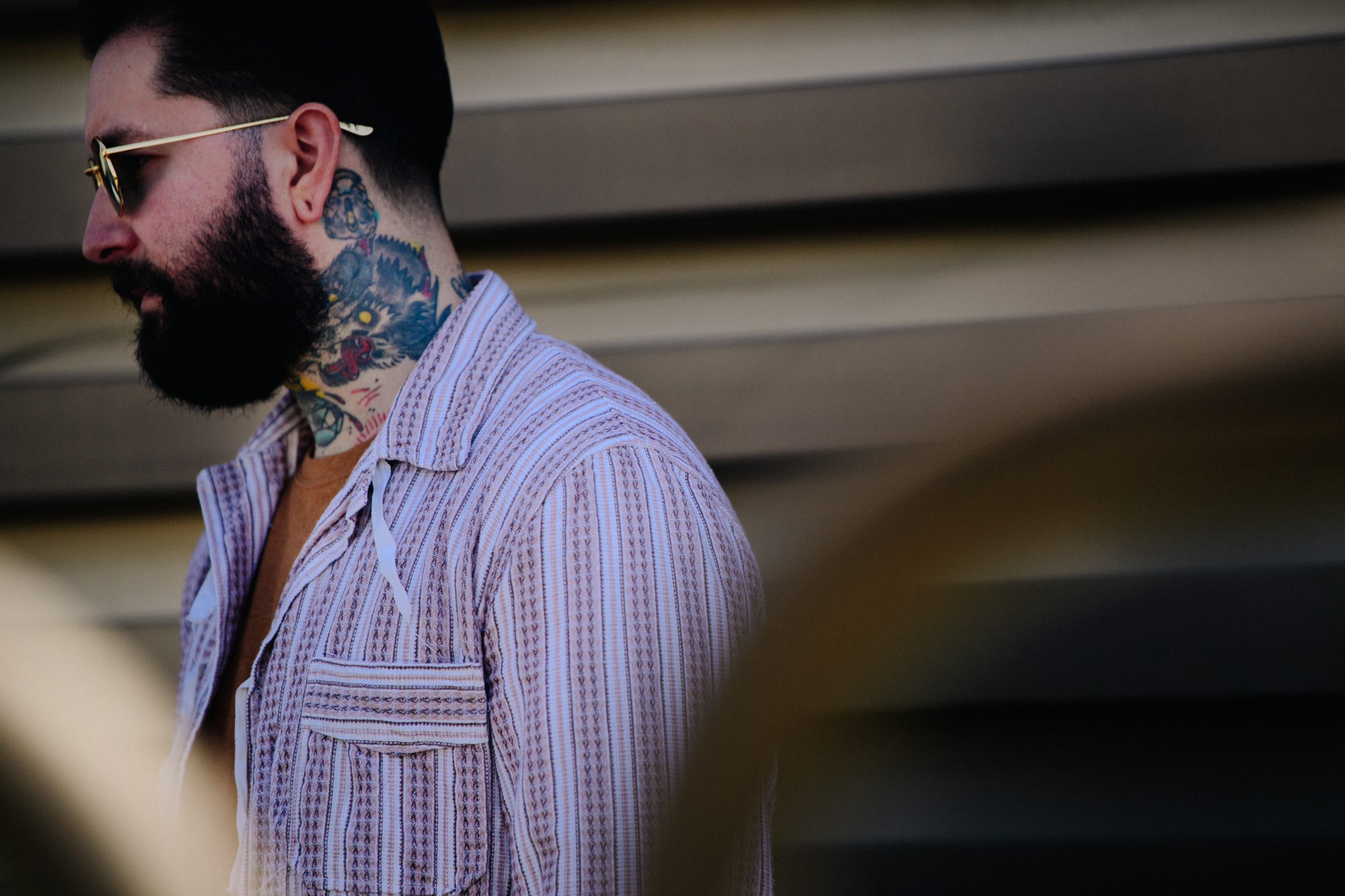 Man with neck tattoos