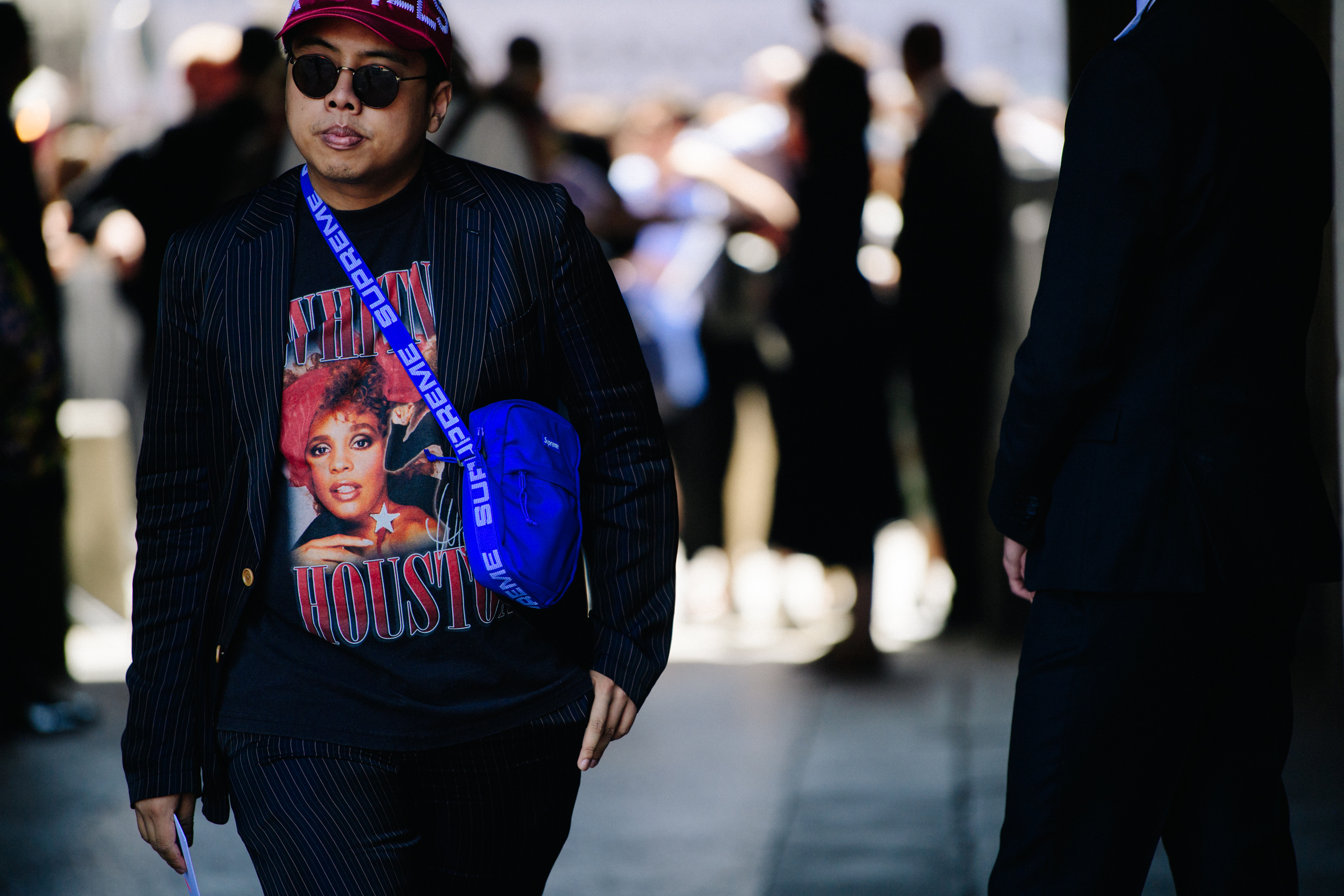 Asian man wearing Supreme