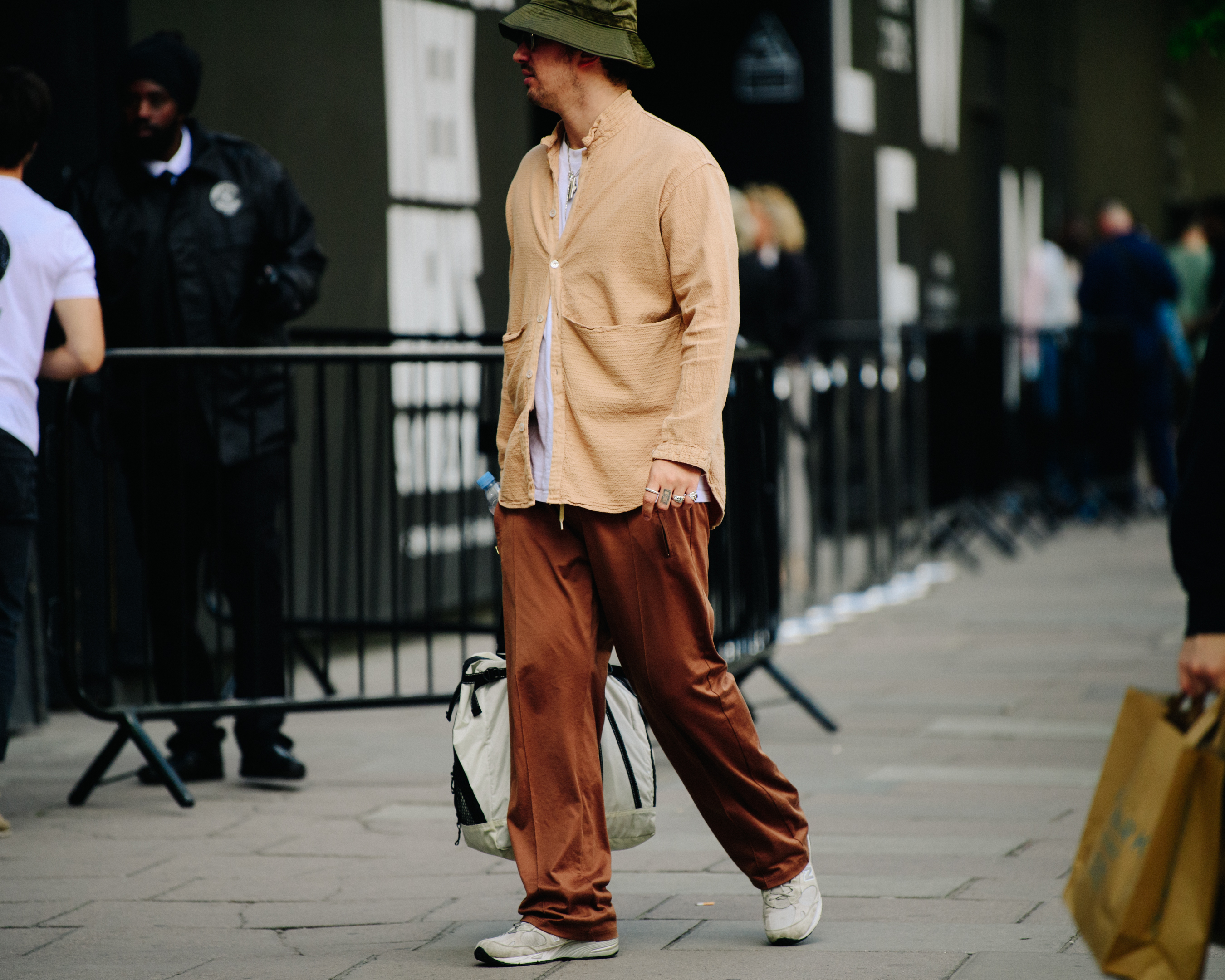 English stylist wearing tan outfit
