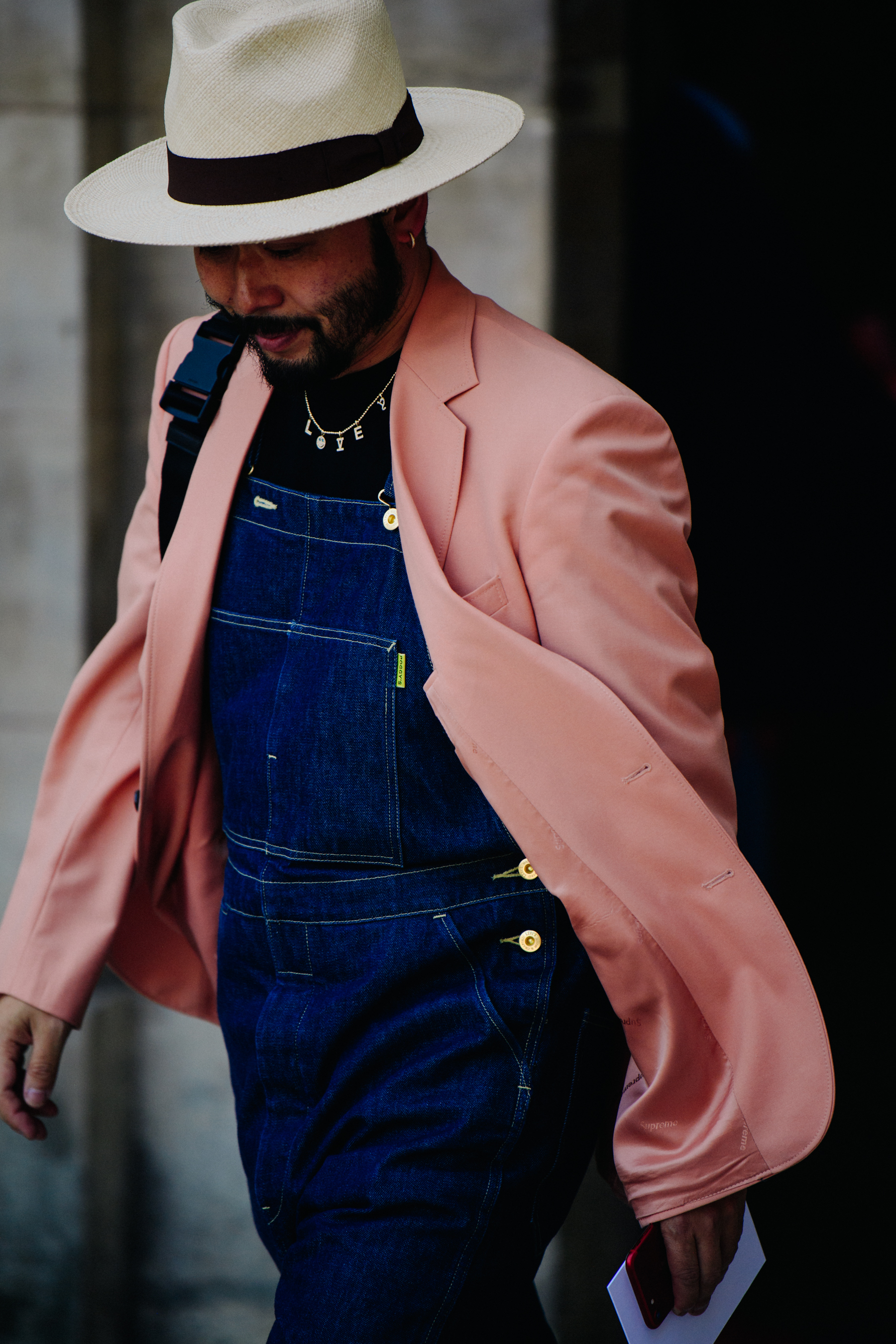 Asian man wearing pink coat