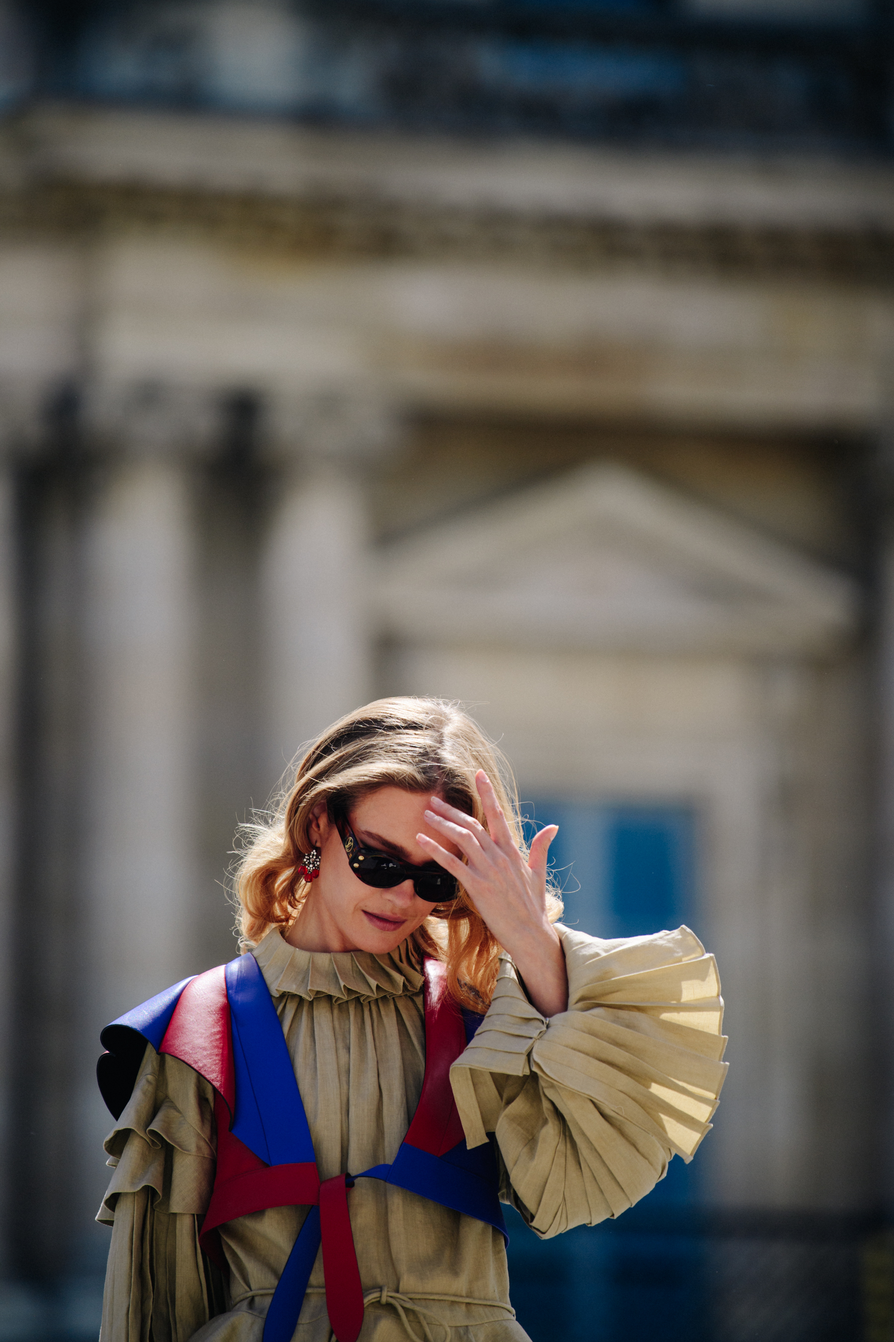 Supermodel wearing pleated coat