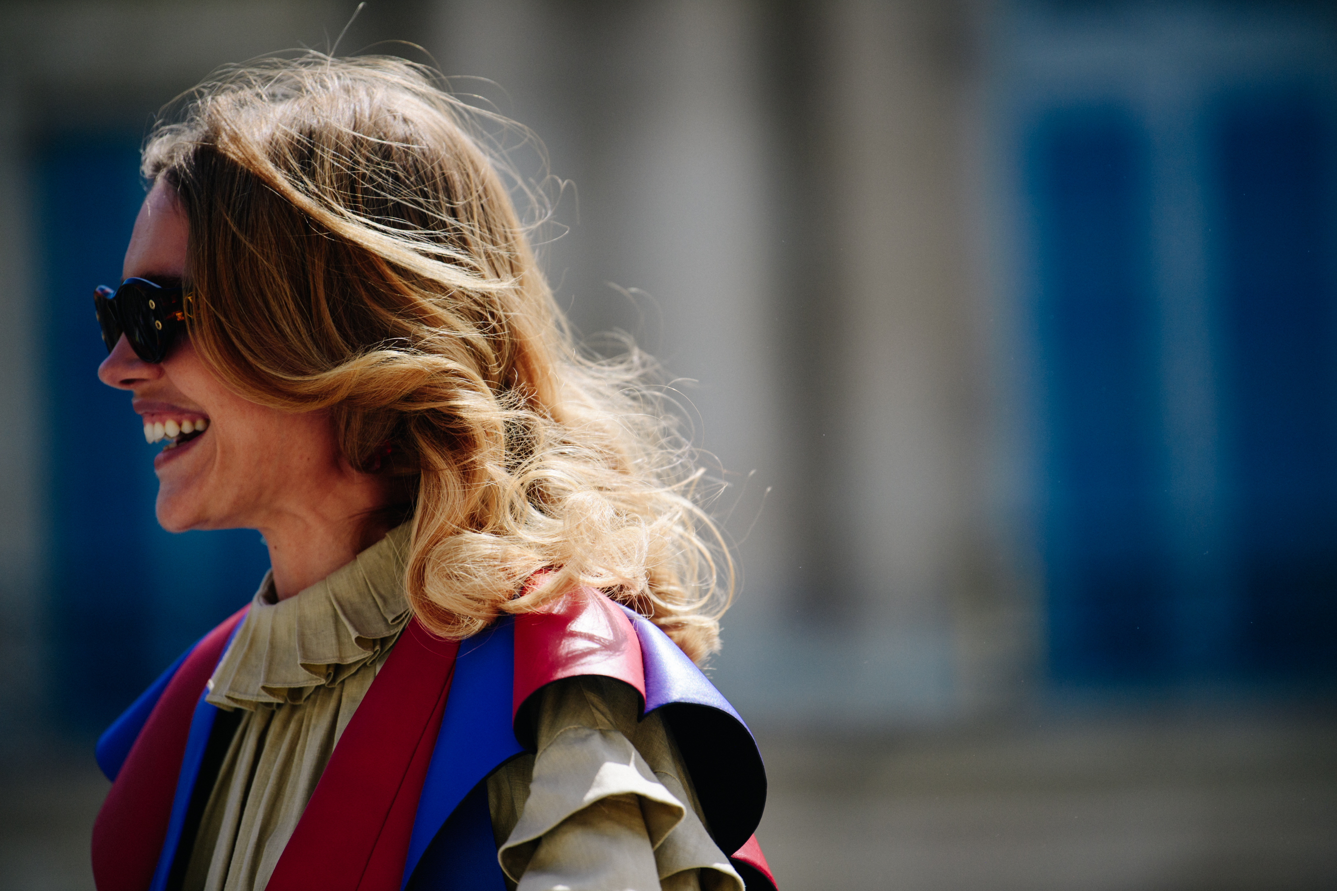 Supermodel wearing pleated coat
