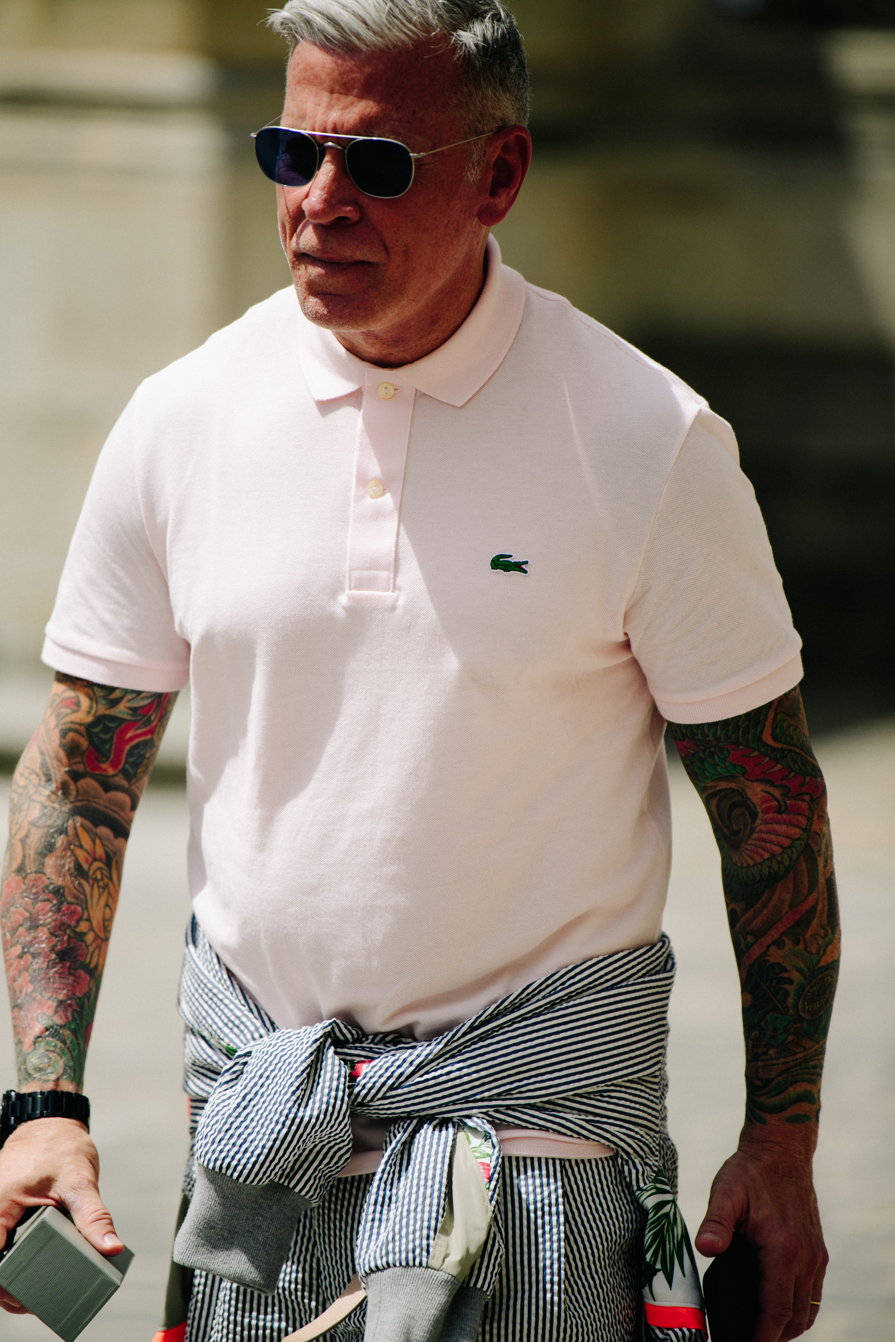 Man wearing Lacoste polo shirt