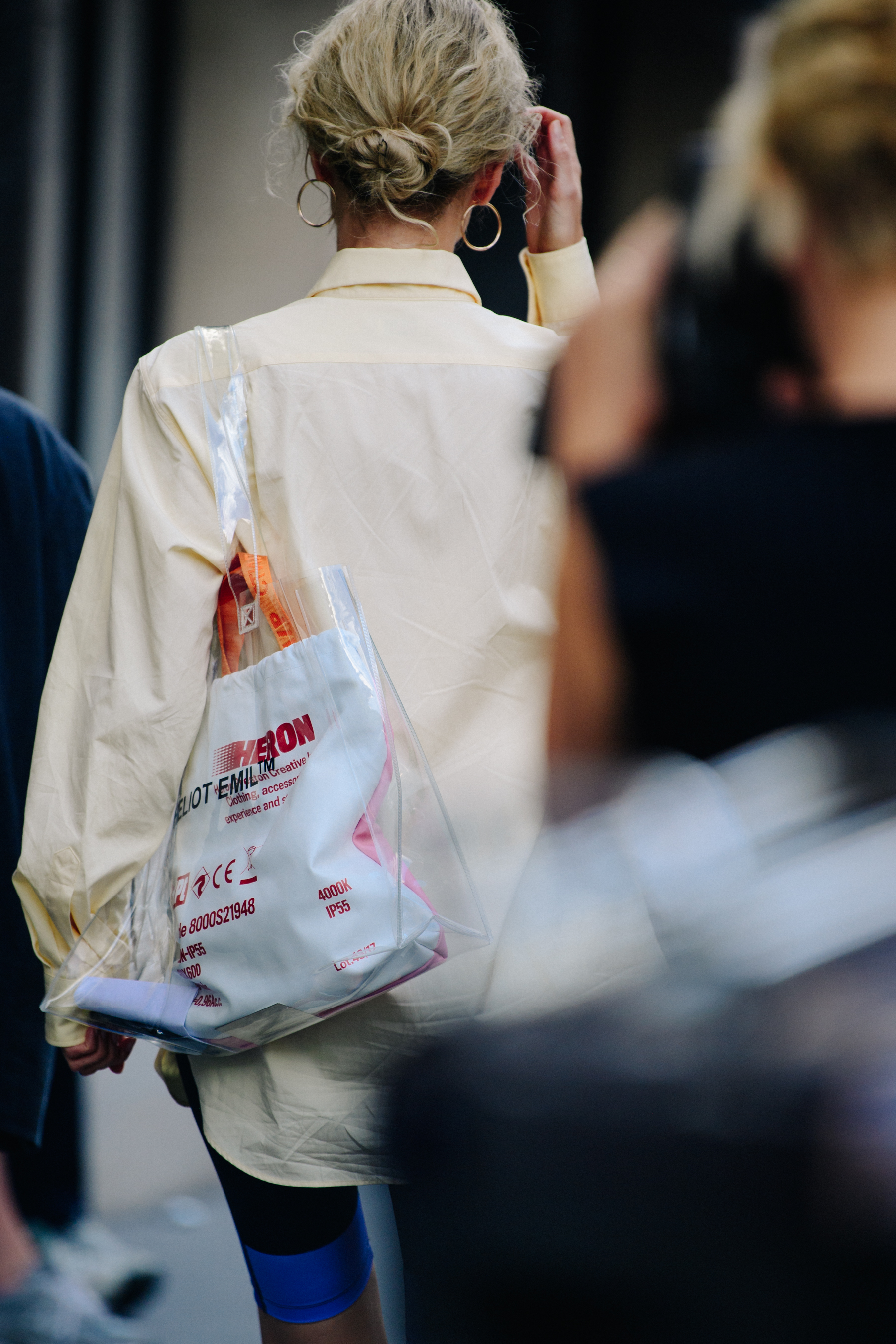 Russian woman carrying plastic bag