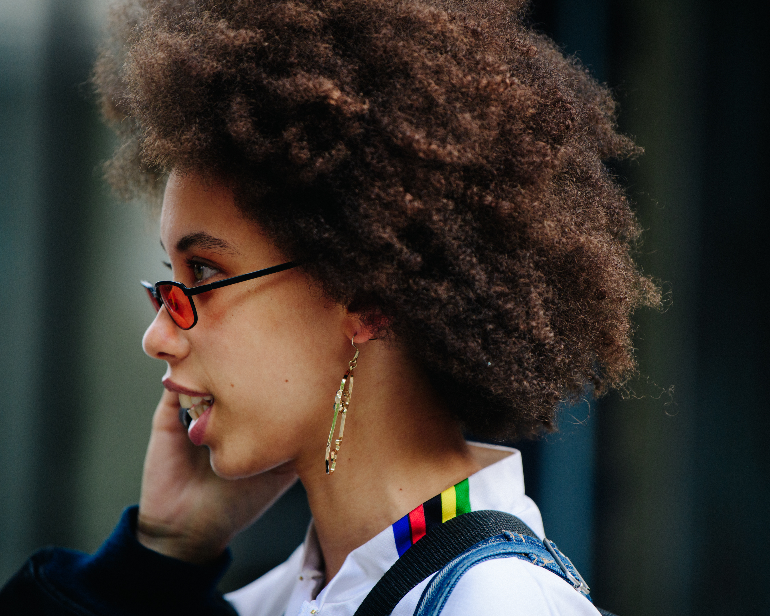 Model wearing gold earrings