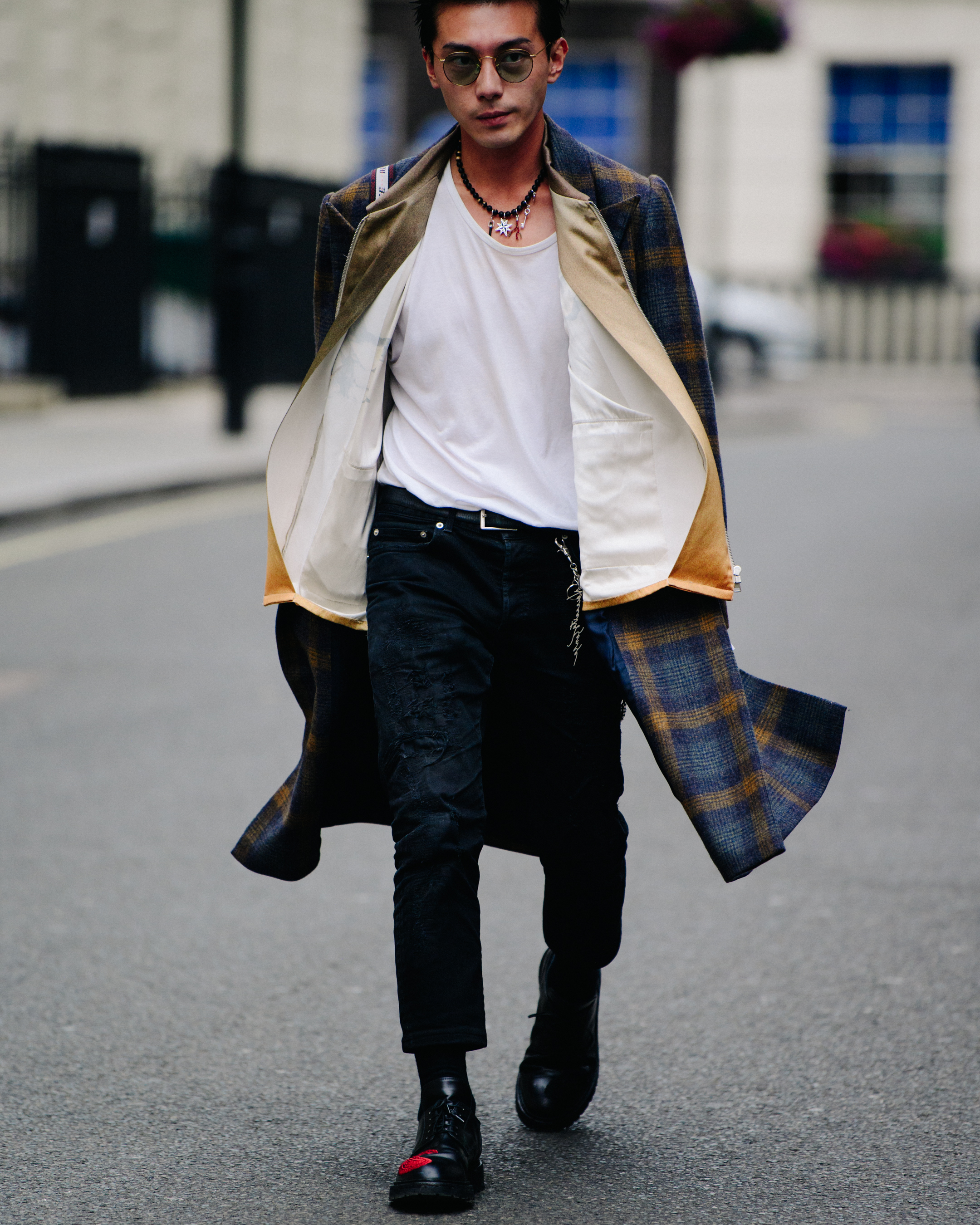 Asian man wearing flowing coat