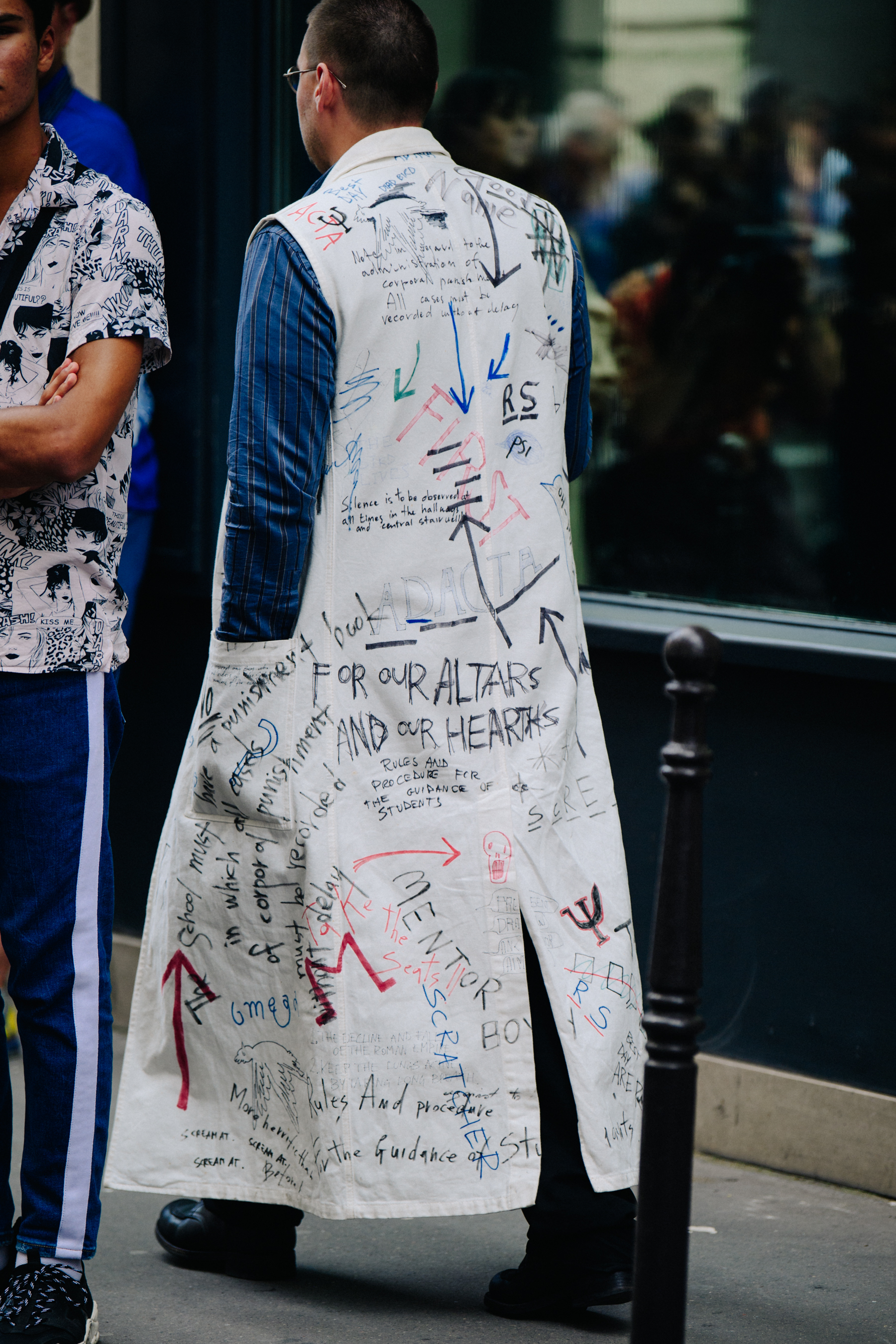 Man wearing hand written coat