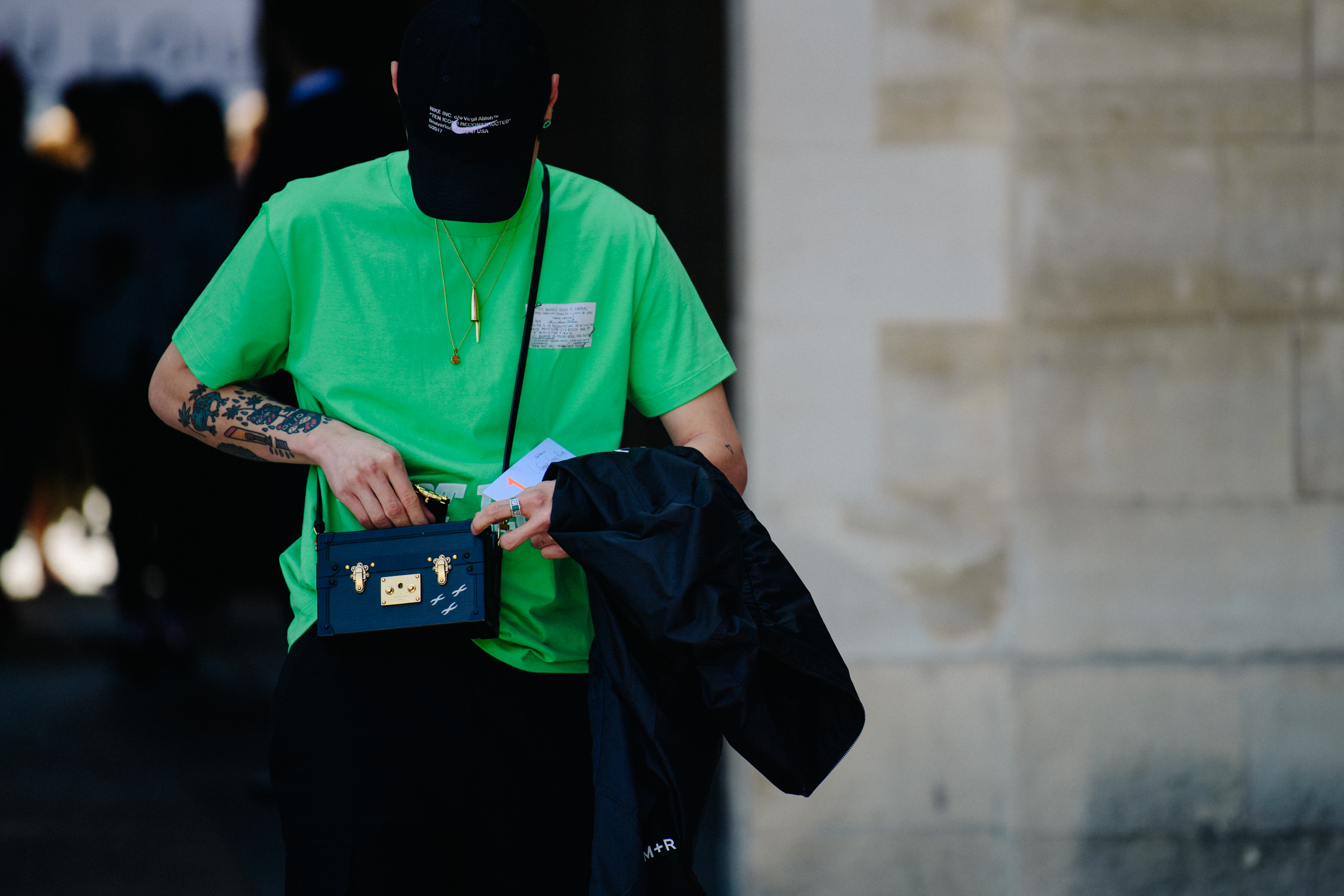 Asian man wearing Off-White hat