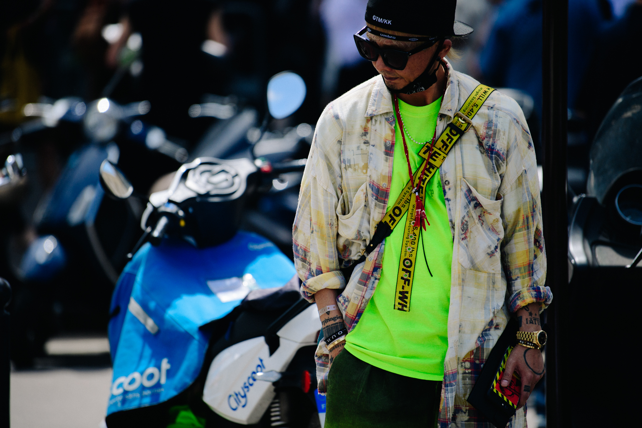 Asian man wearing Off-White bag