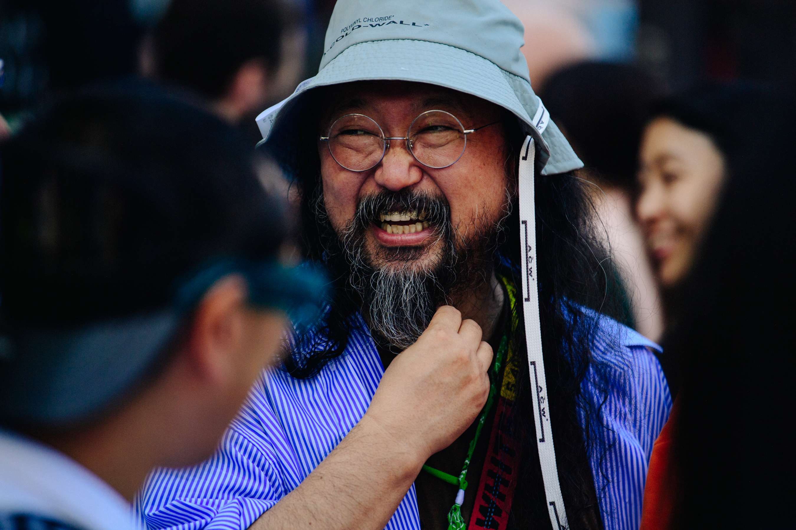 Asian man wearing A Cold Wall hat