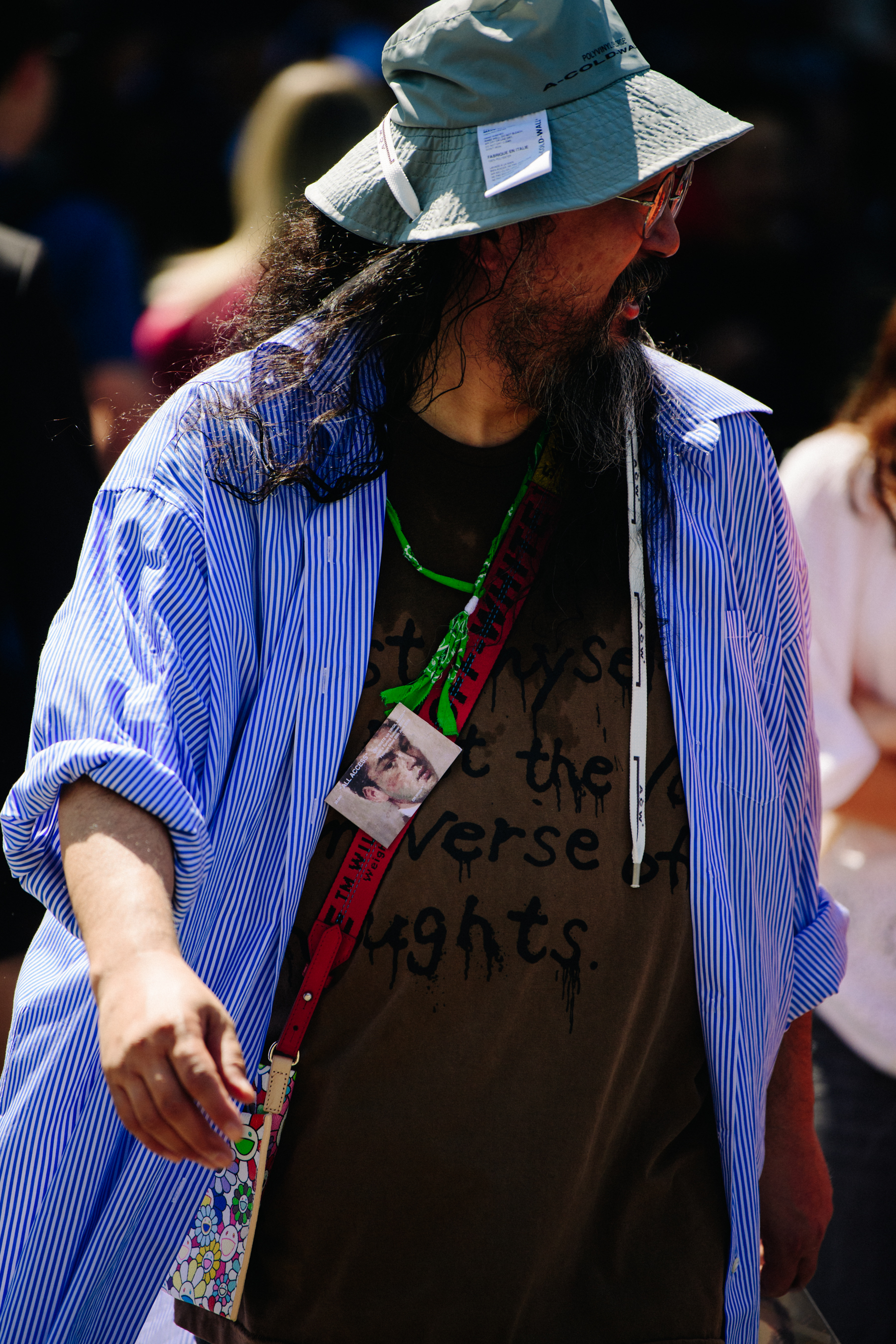Asian man wearing A Cold Wall hat