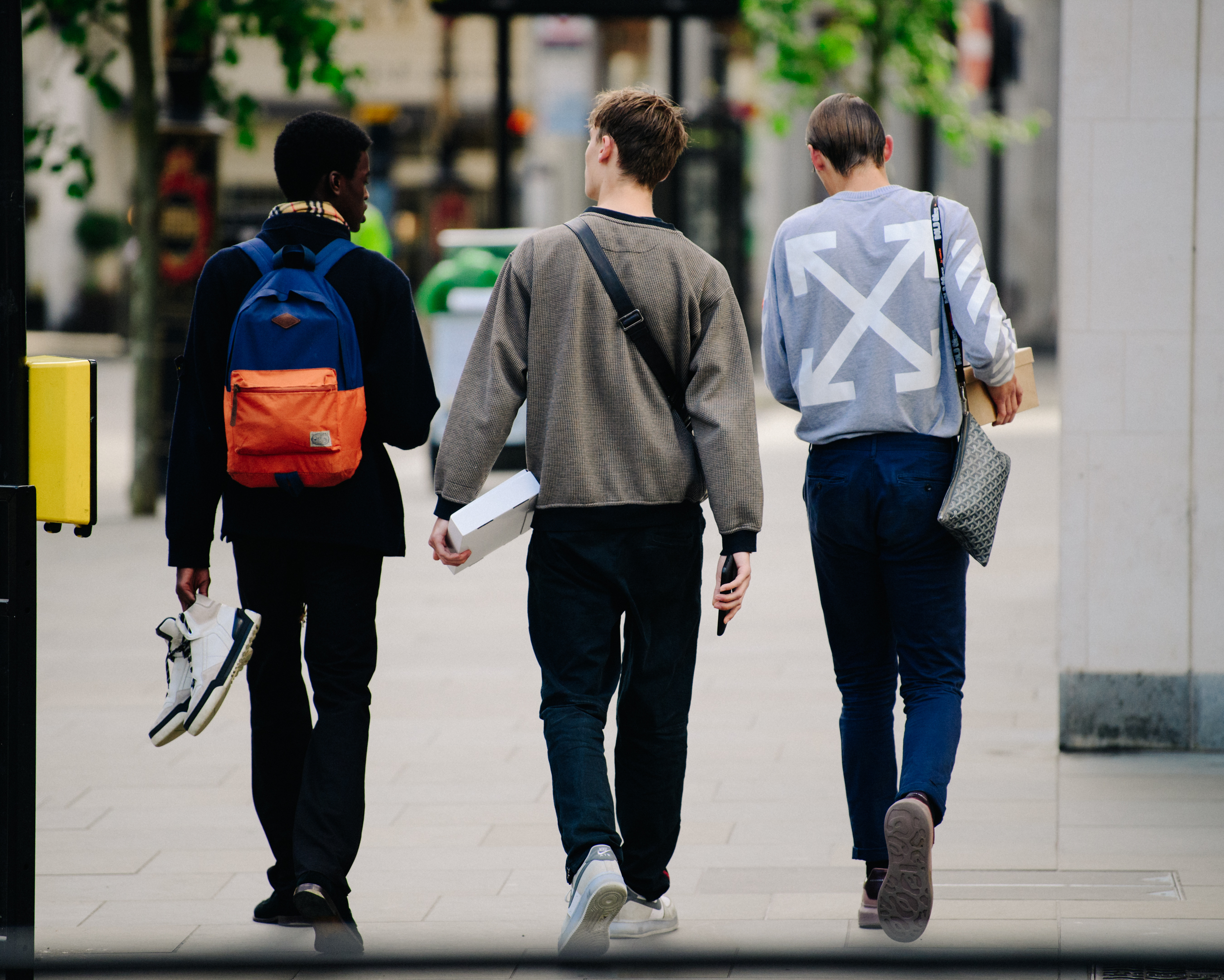 Three male models leaving show