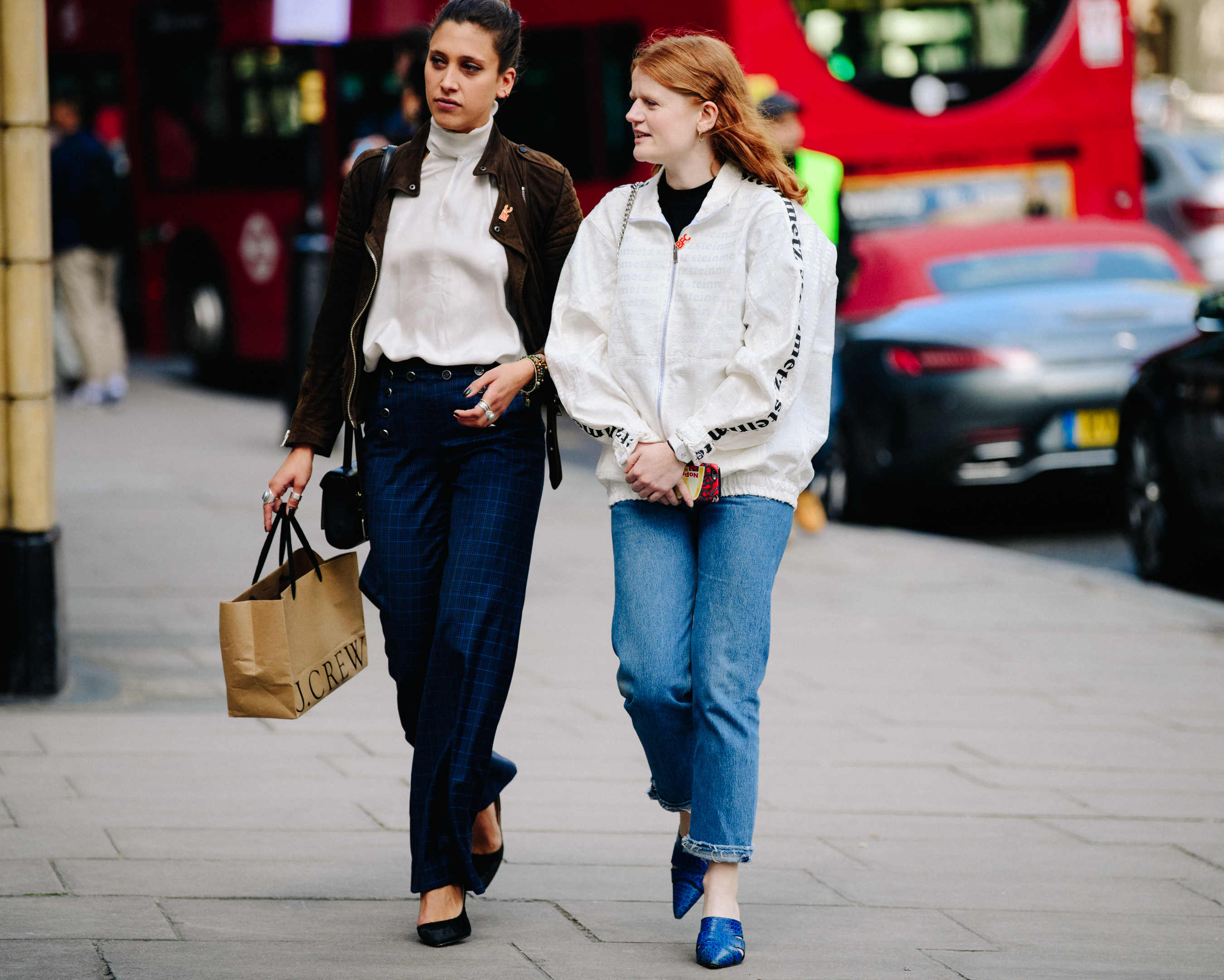 Two women wearing light jackets