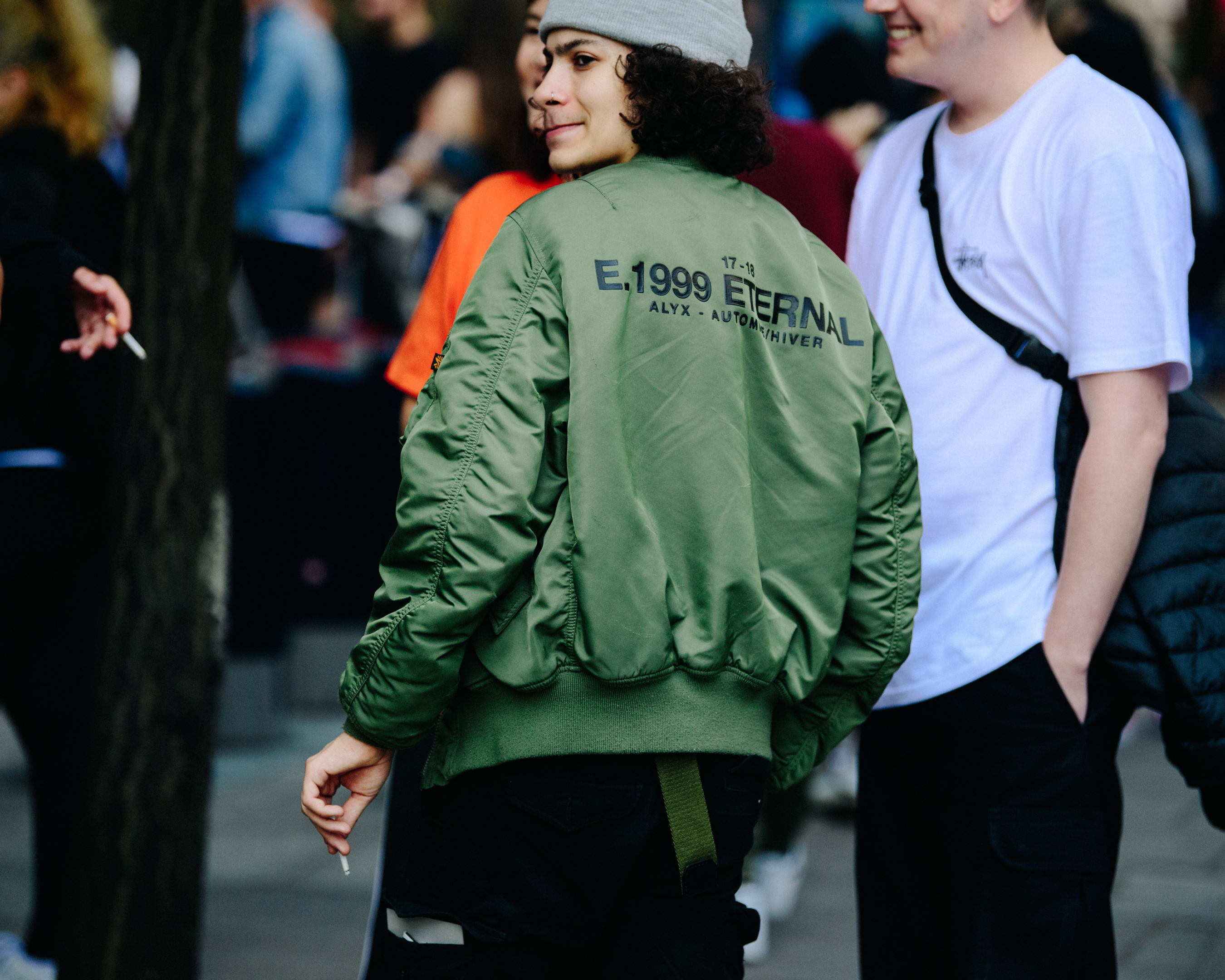 Woman wearing green bomber jacket