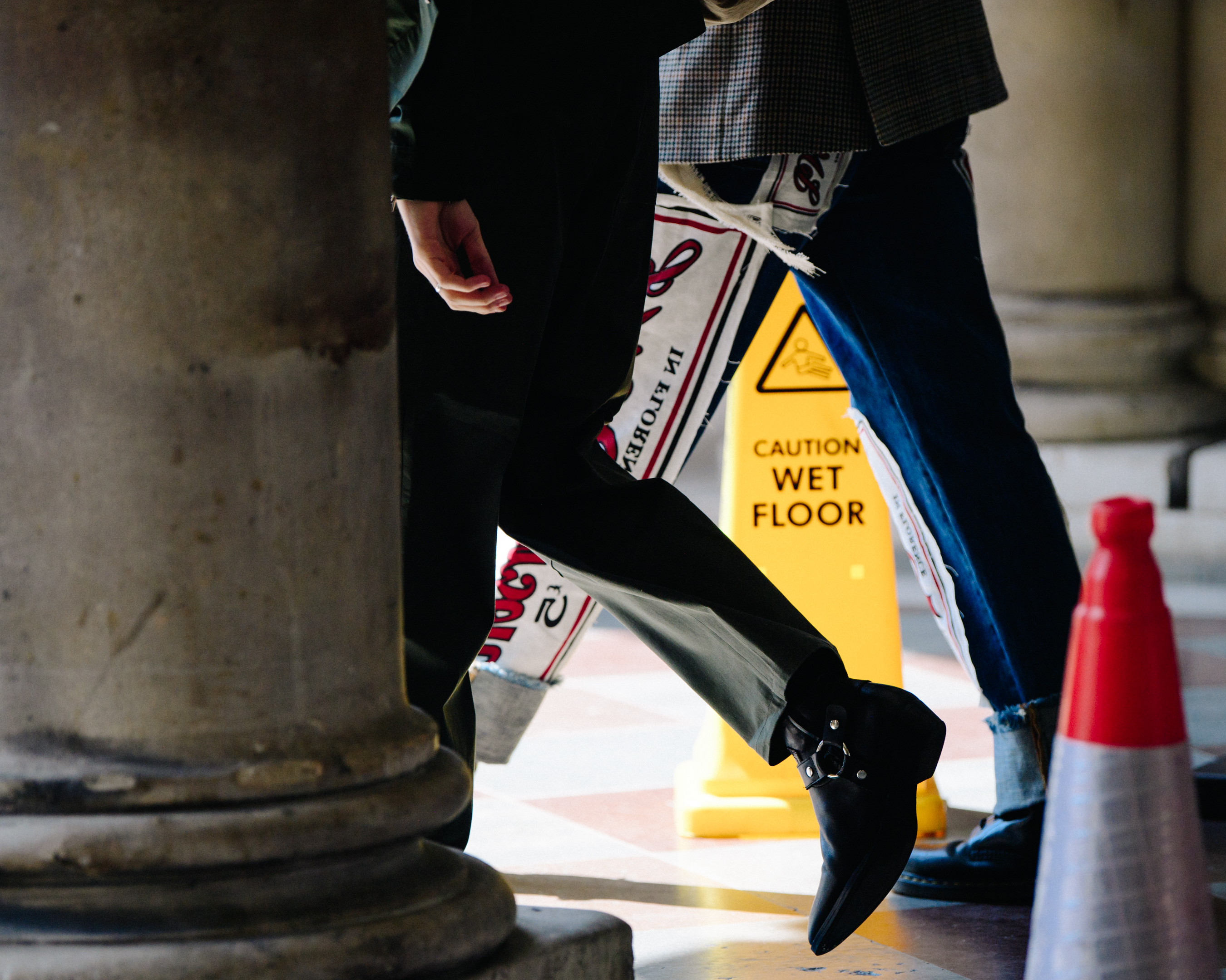 Man wearing black heeled boots
