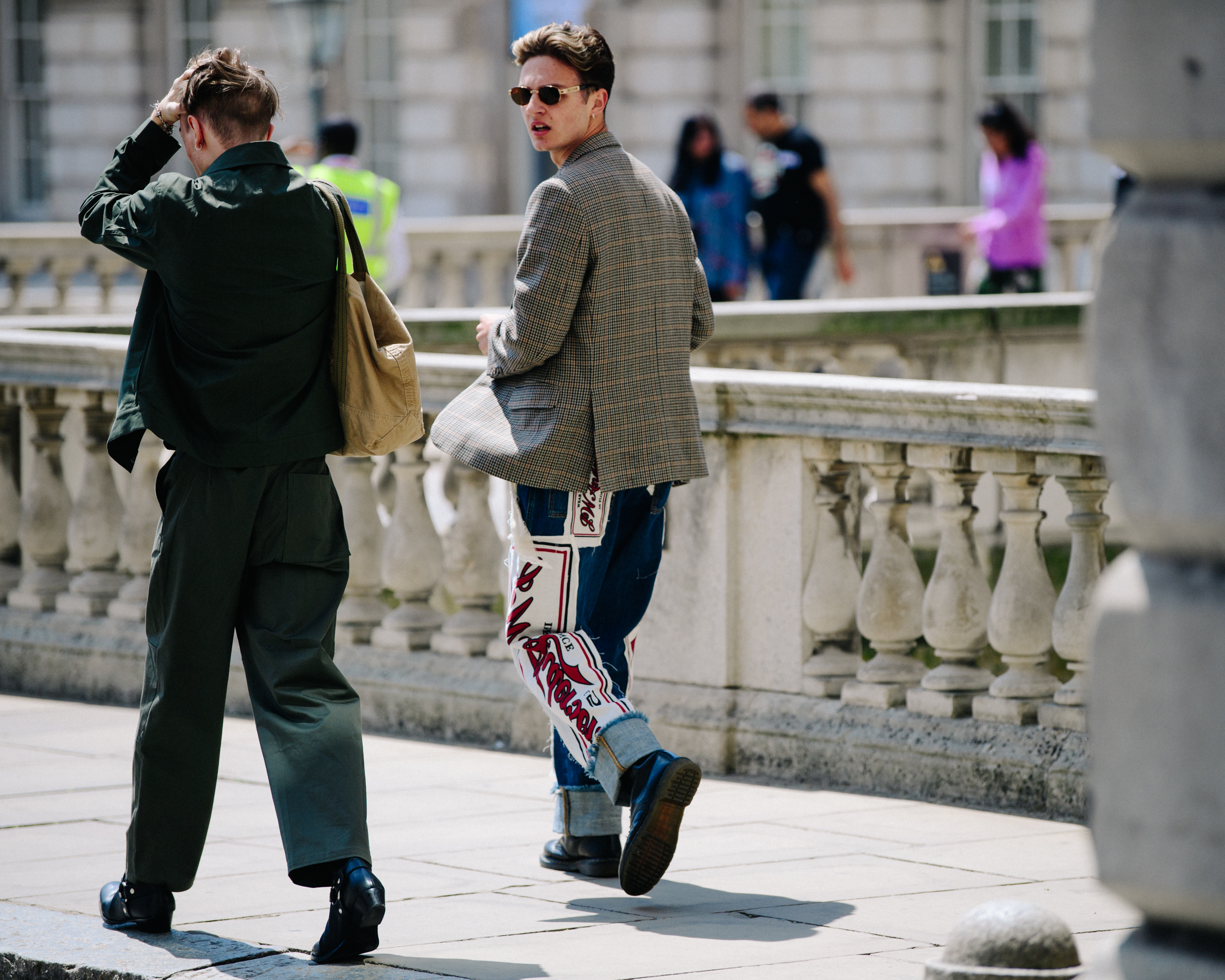 Two men wearing light jackets