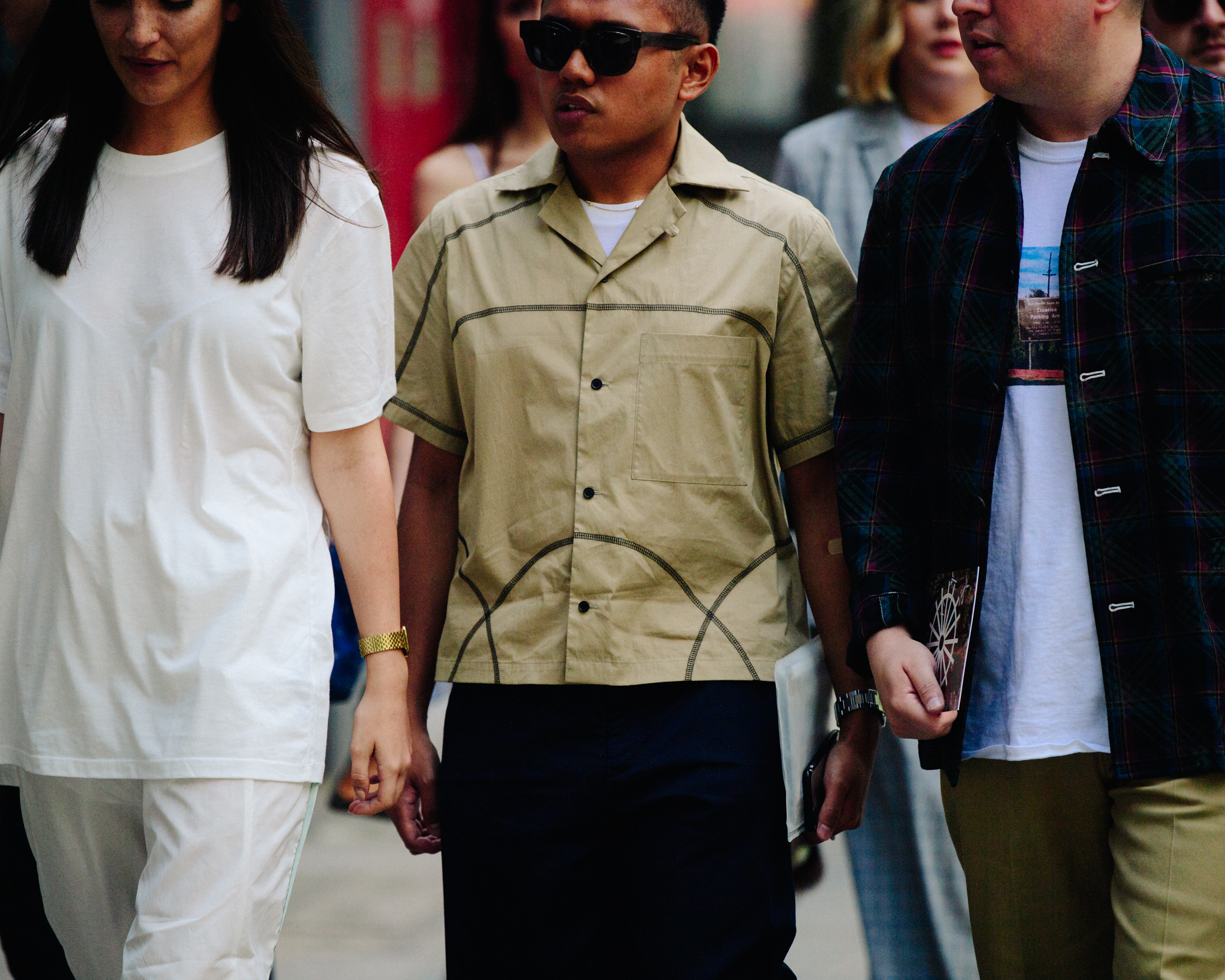 Three people wearing smart shirts