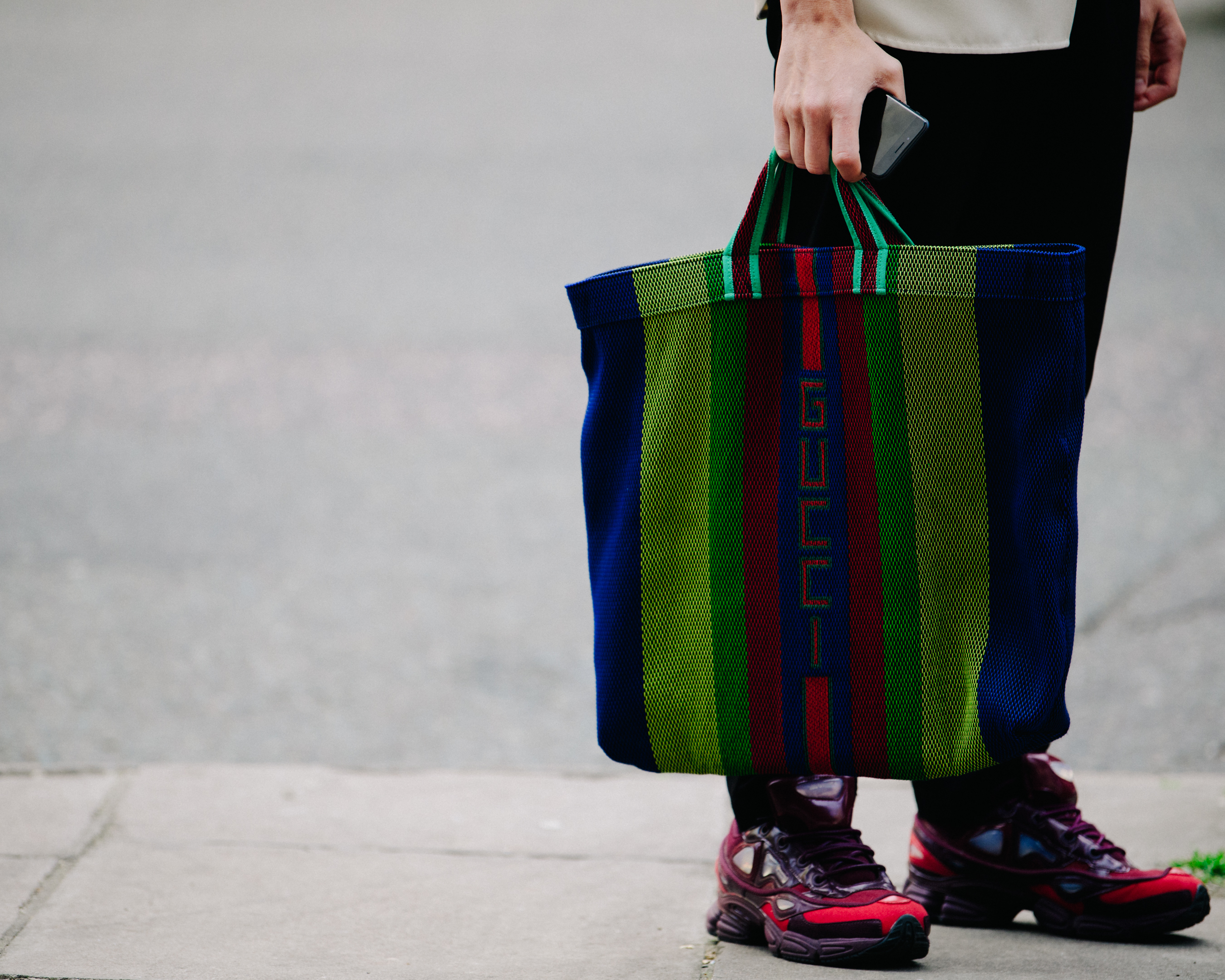 Man carrying Gucci bag