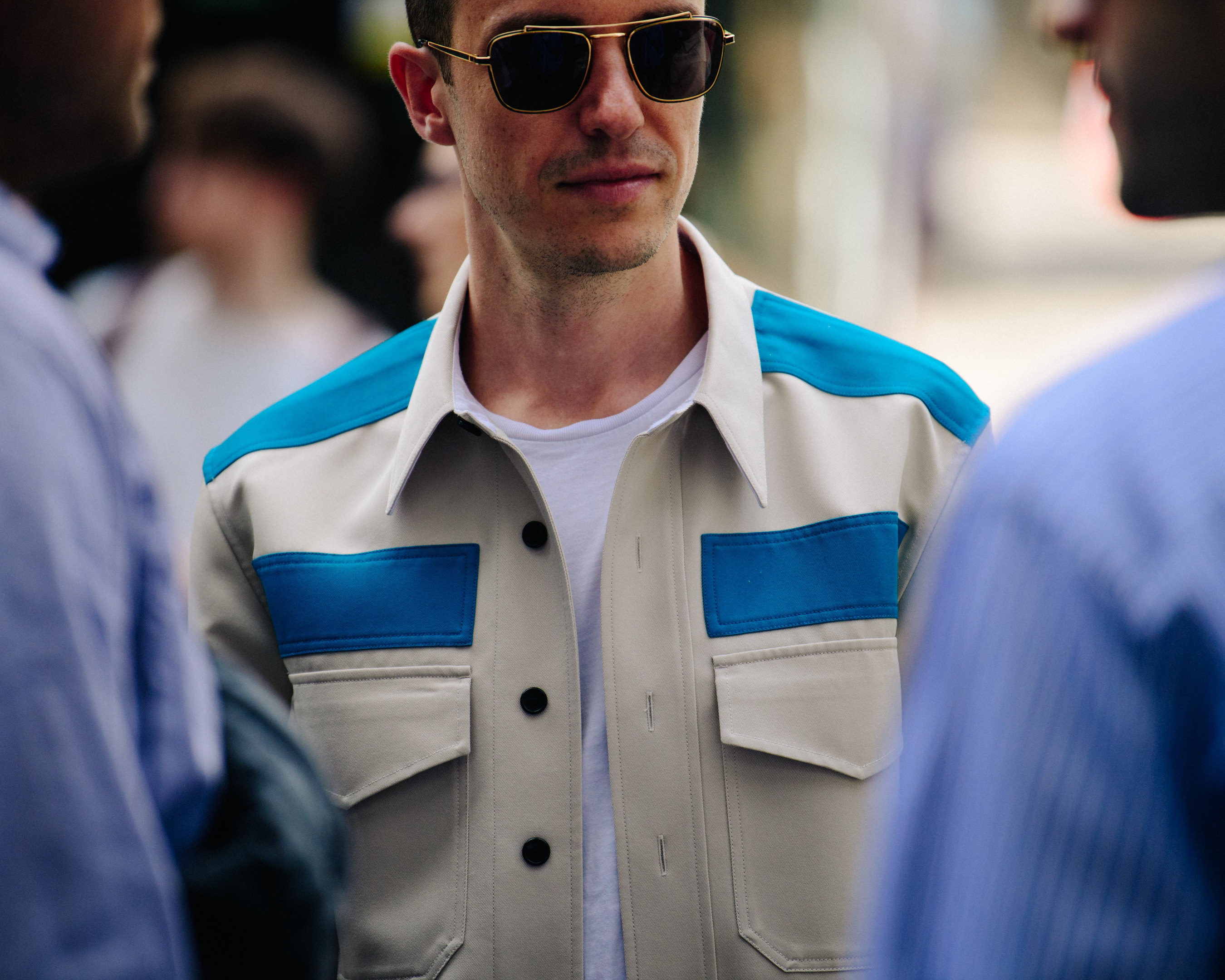 Man wearing blue and cream jacket