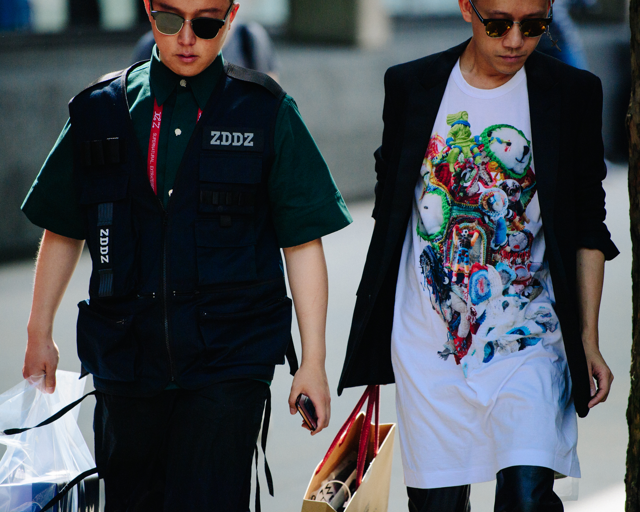 Two Asian men wearing fashionable outfits