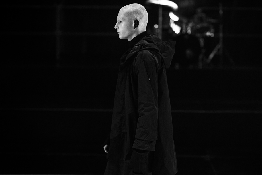 Male model walking the Nom*d runway
