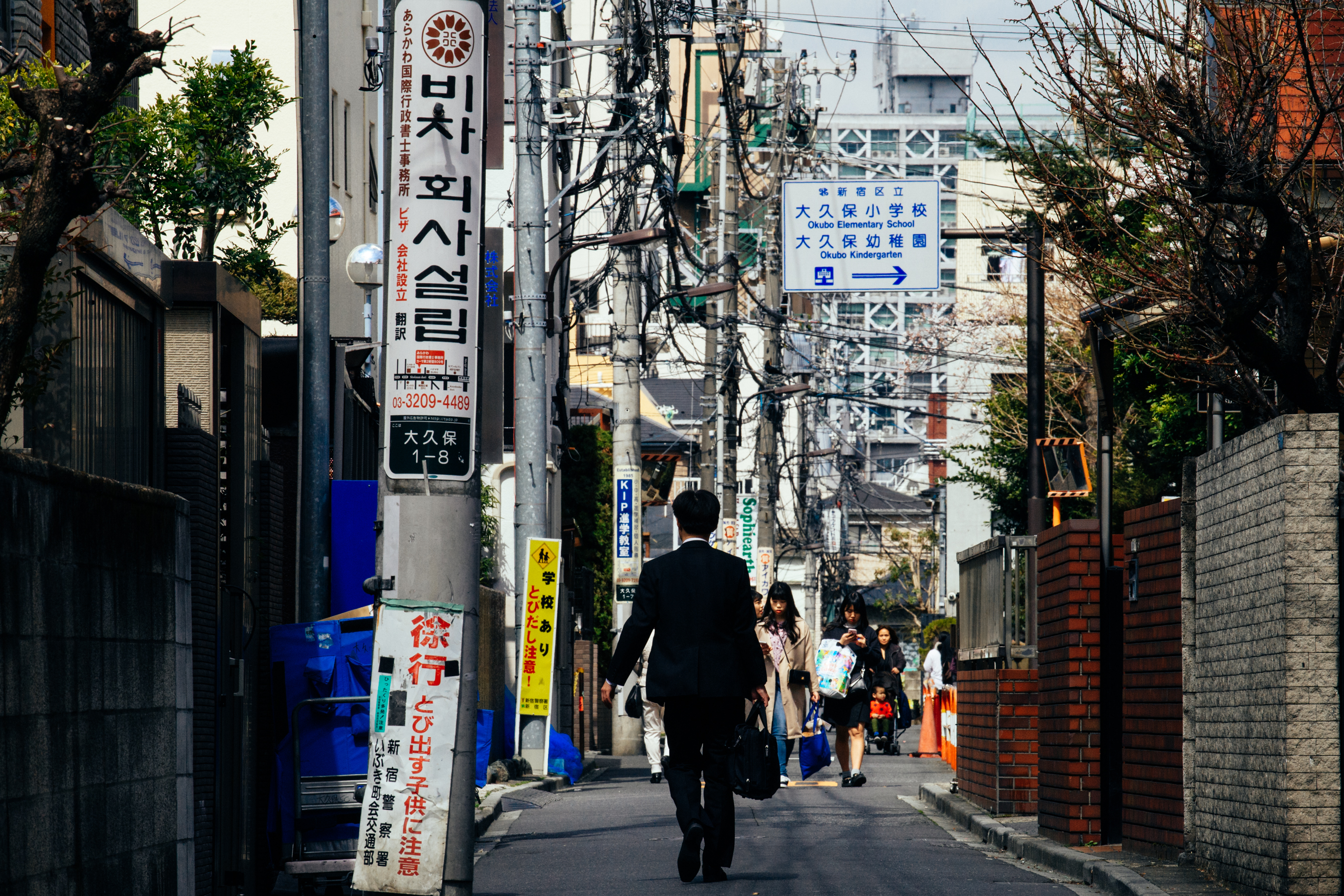 A small street with people walking in Japan