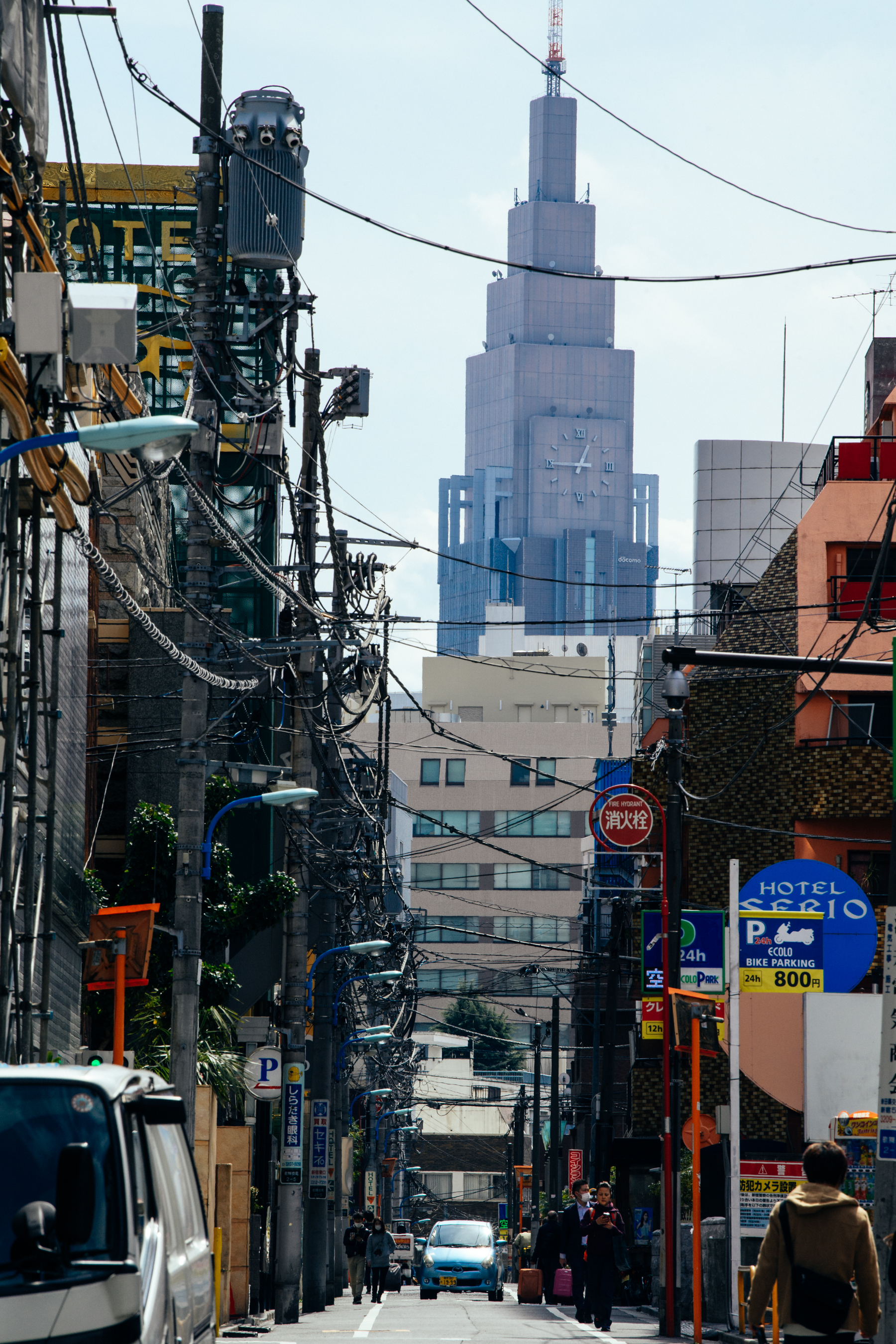 A tall building with a clock in Tokyo