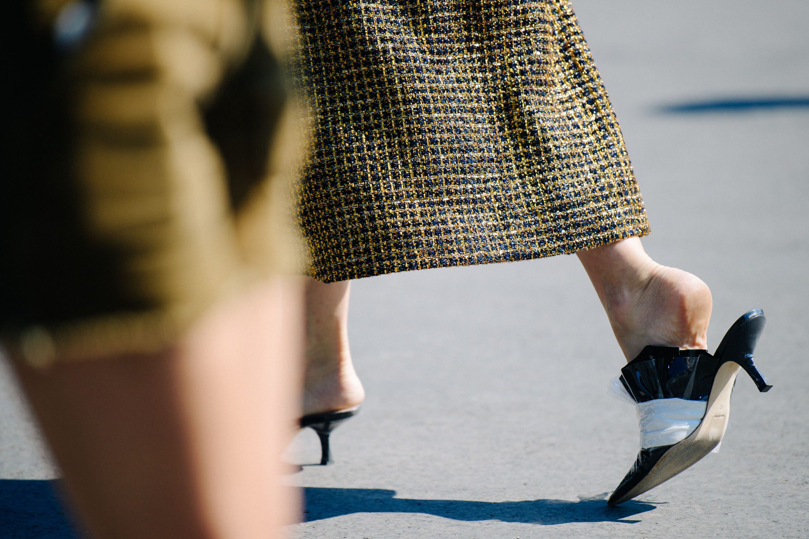 Woman wearing black and white heels