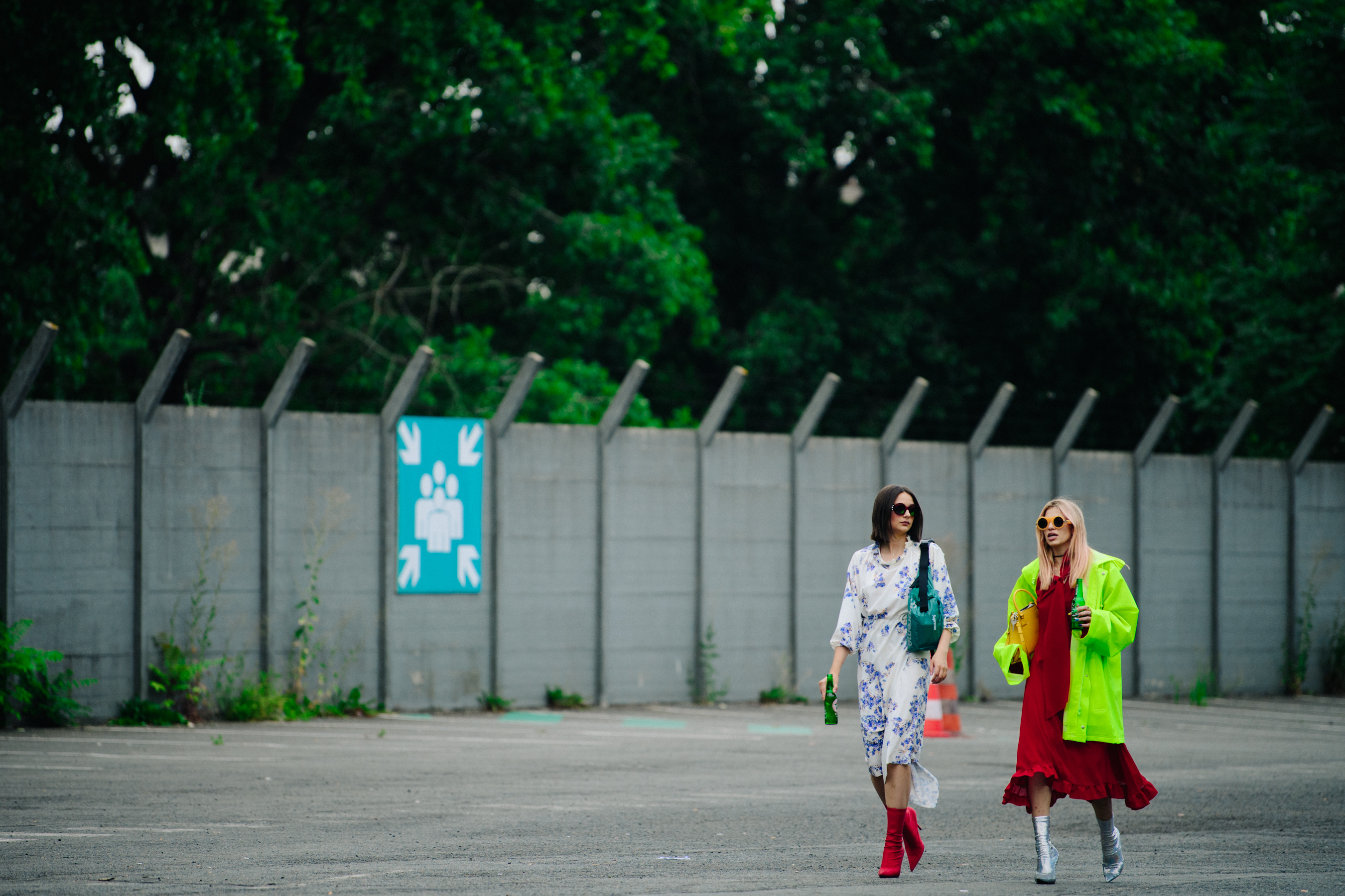 Two women wearing colourful dresses