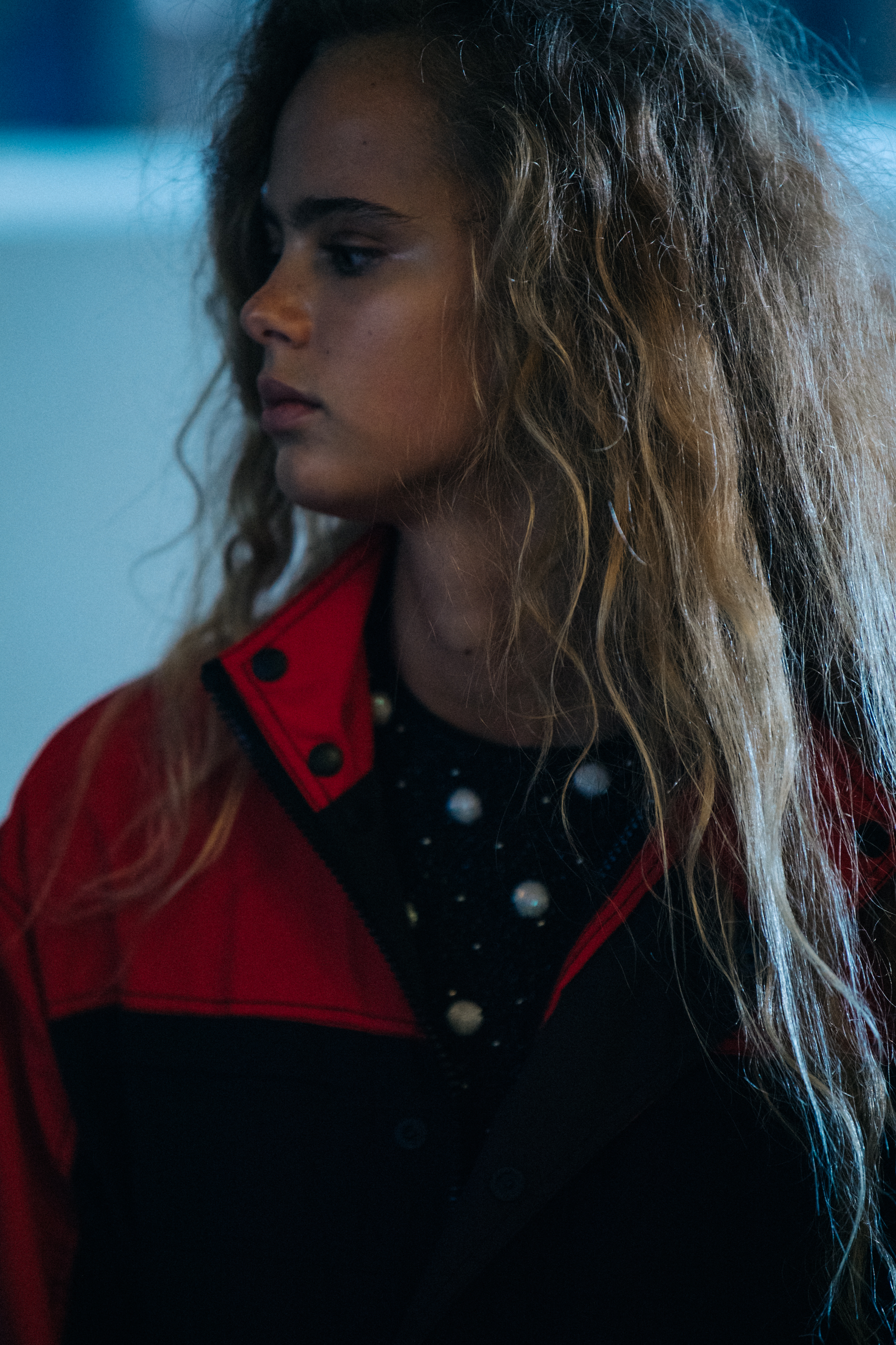 Model wearing red jacket at Ganni