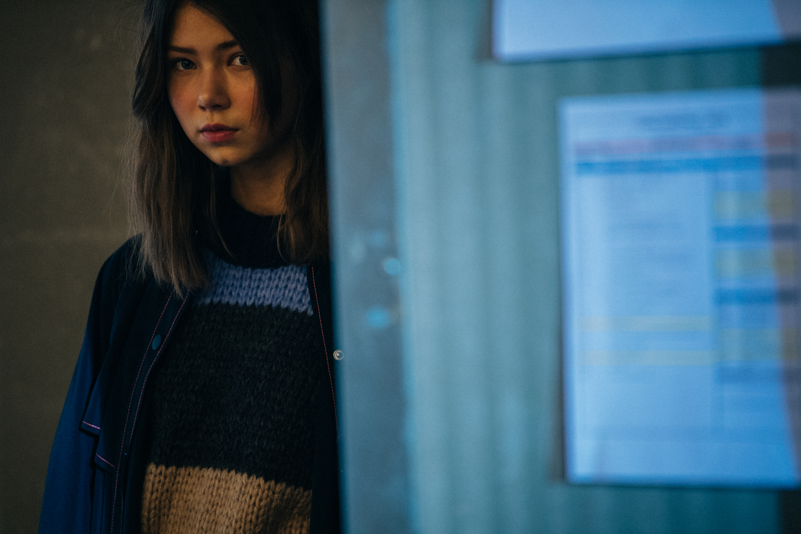 Model wearing blue outfit backstage