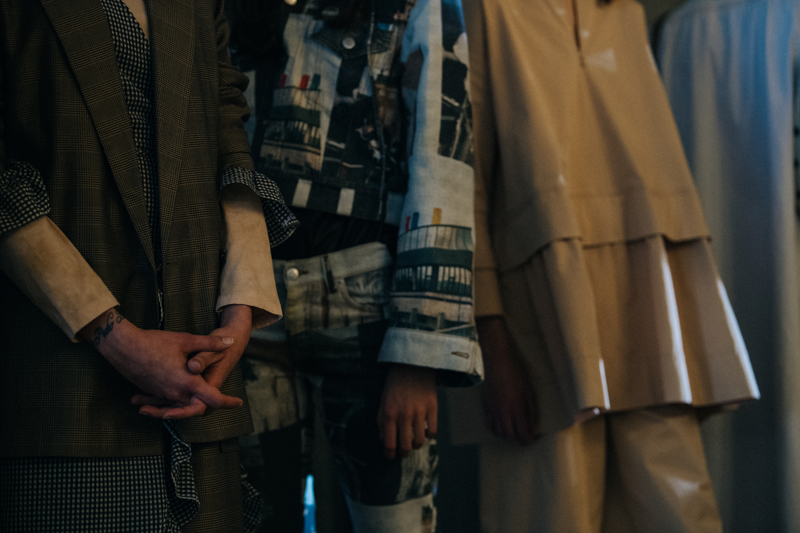 Models in lineup backstage at Ganni