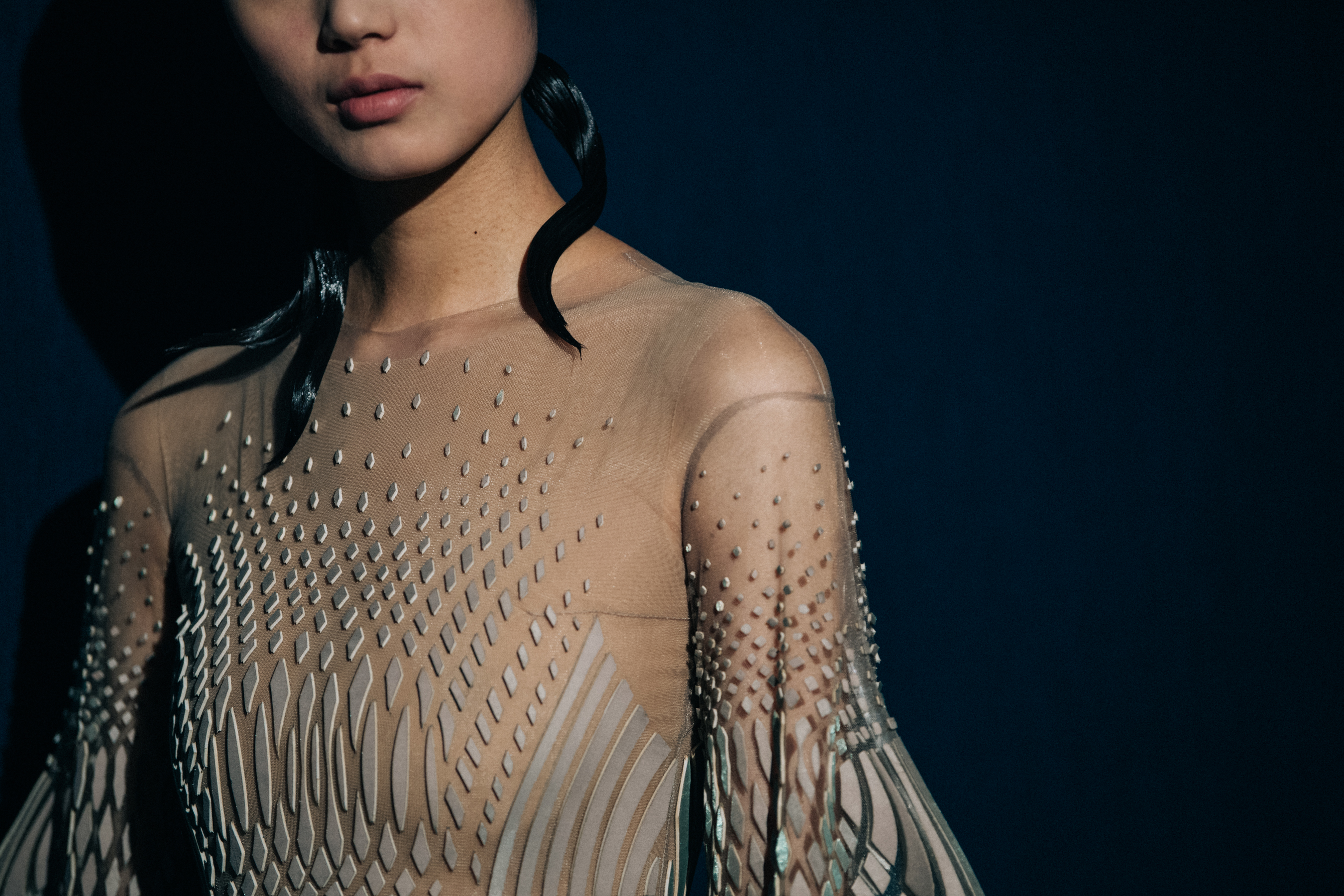 Model wearing elegant designed dress