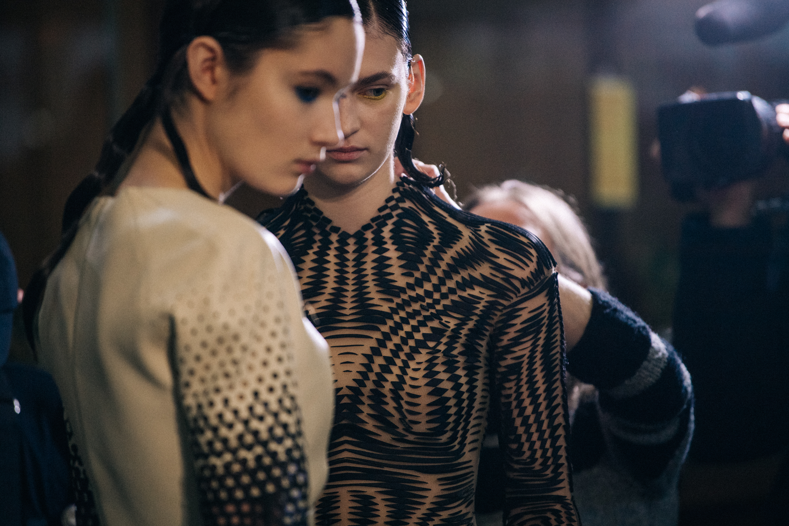 Two models backstage wearing Iris van Herpen couture