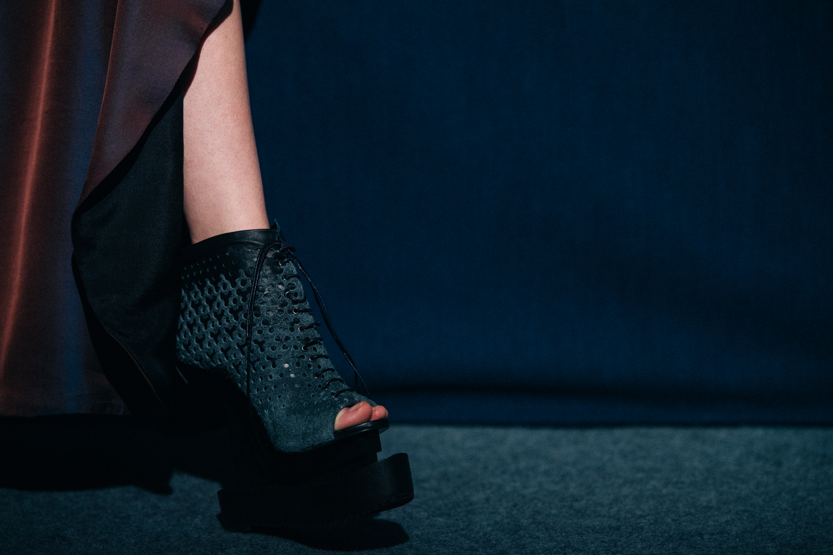 Model wearing heels backstage