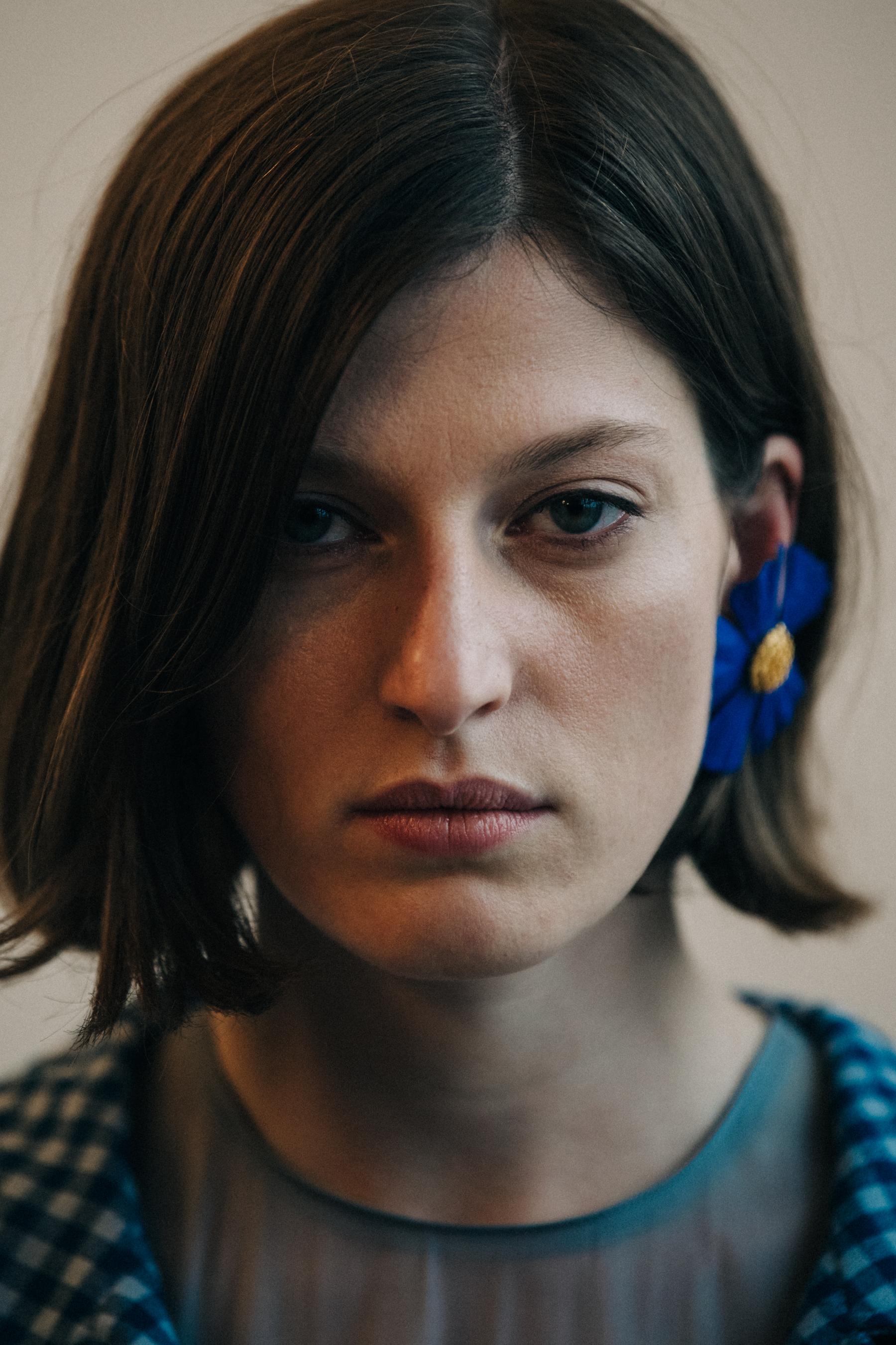 Portrait of model wearing floral earring