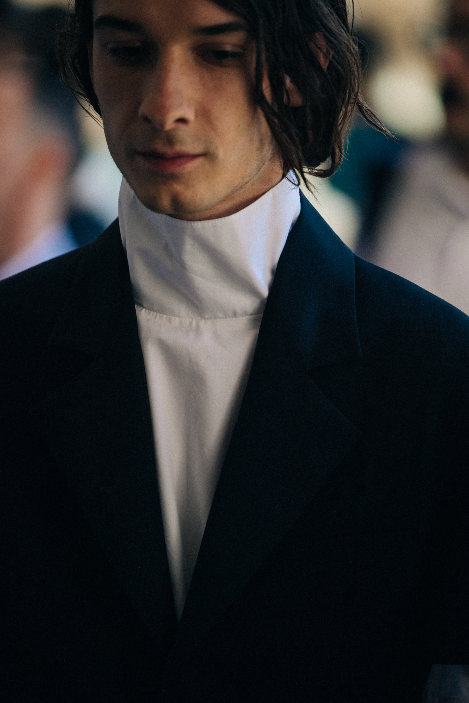 Model wearing white shirt backstage