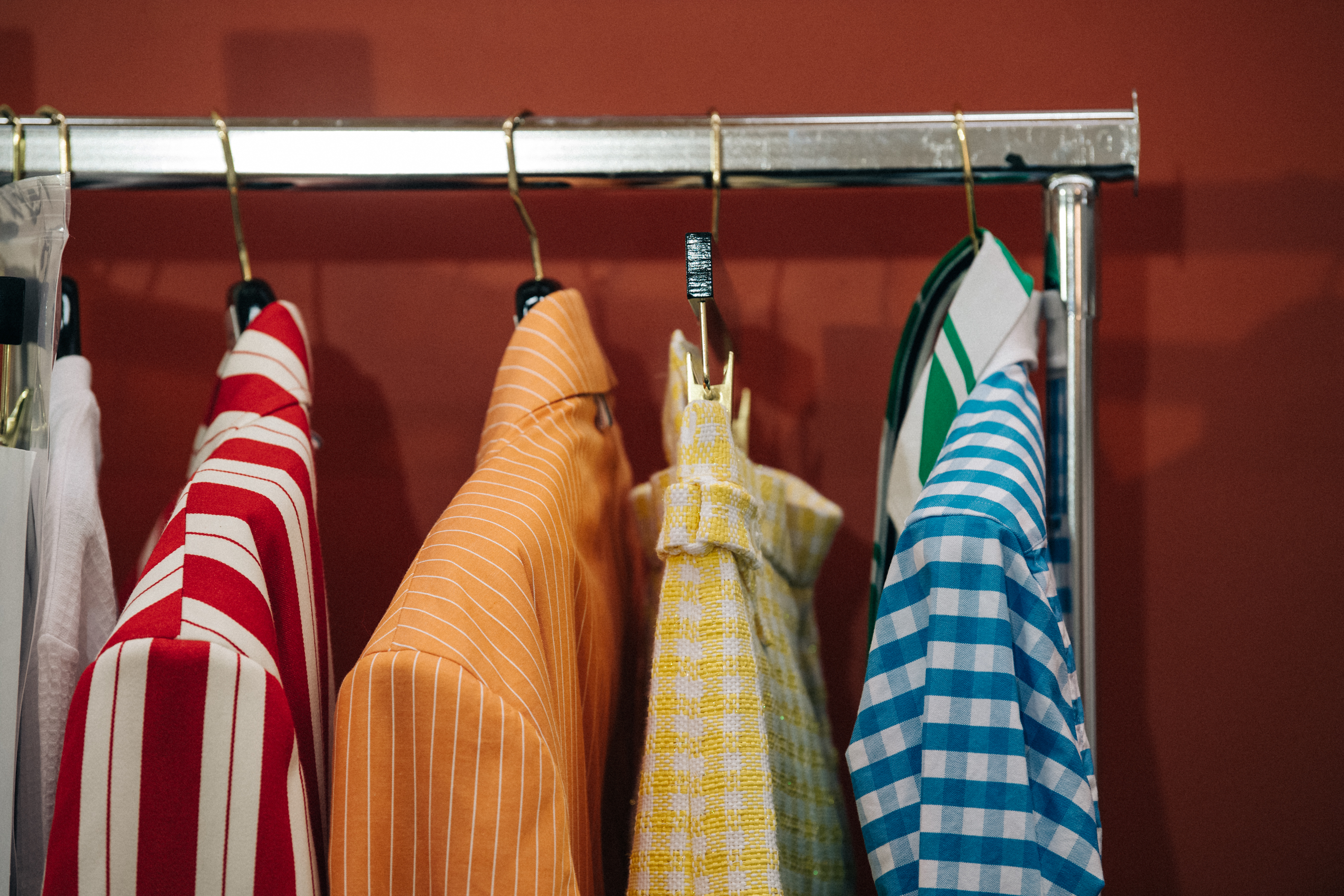 Clothes hanging backstage at Thom Browne