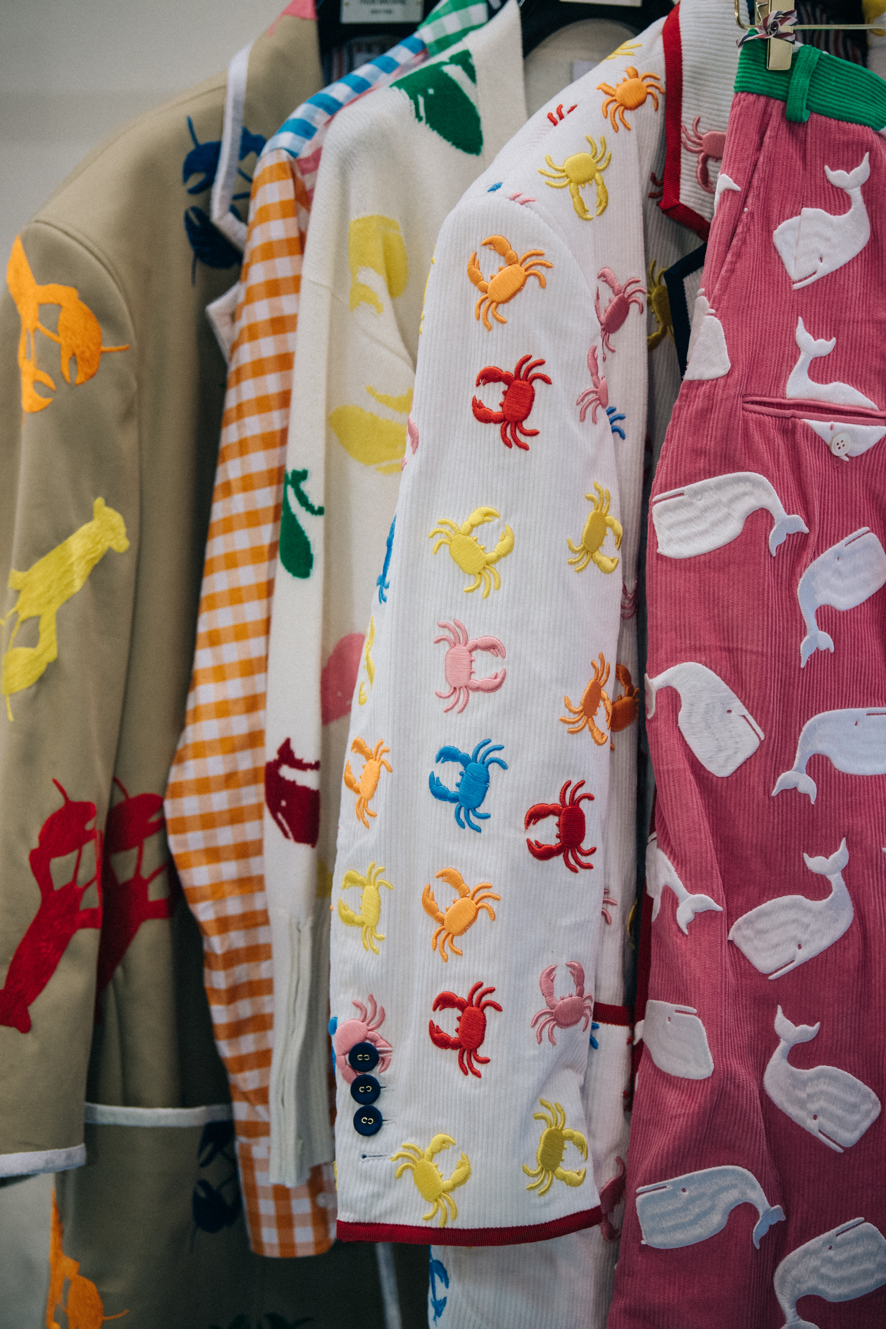 Clothes hanging backstage at Thom Browne