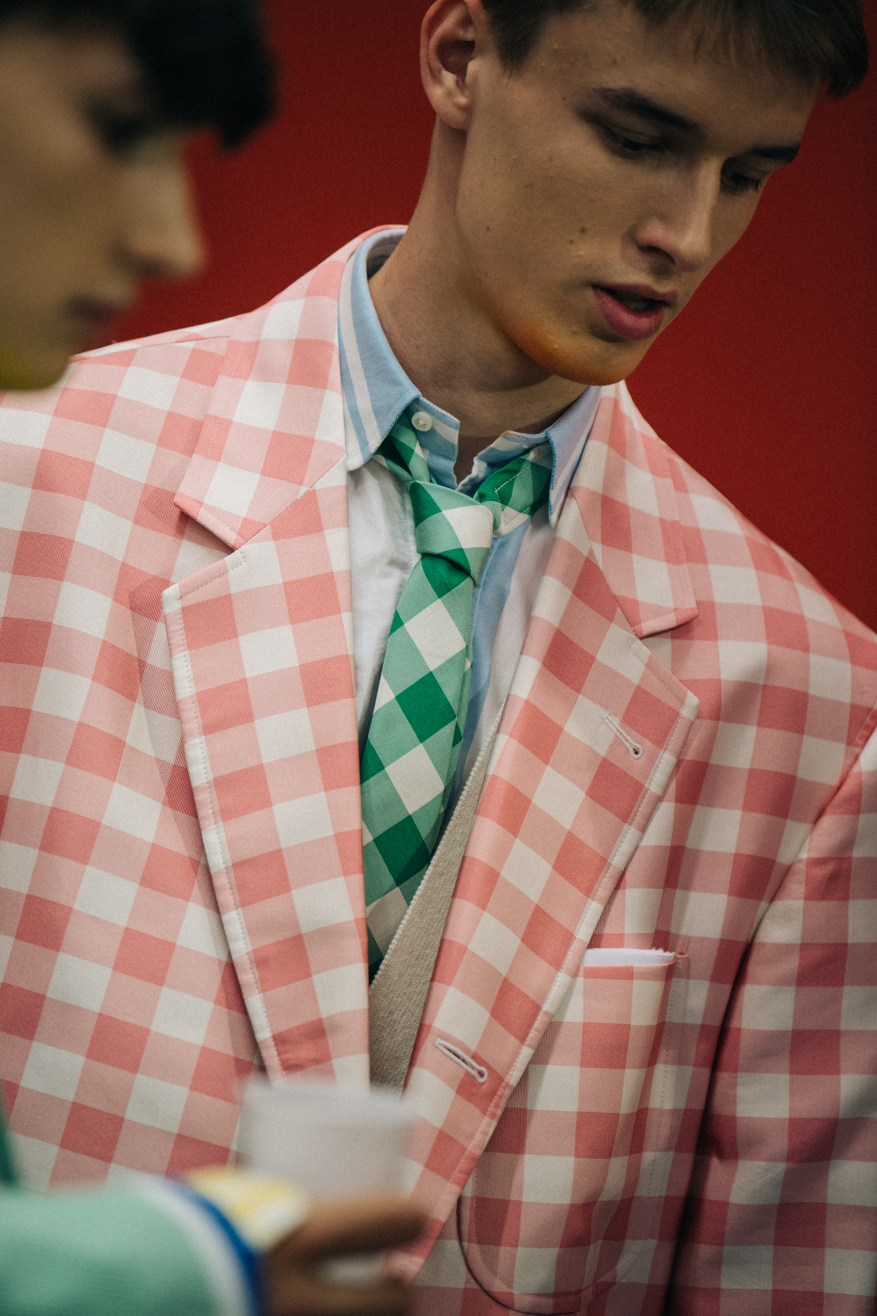 Model wearing pink check at Thom Browne