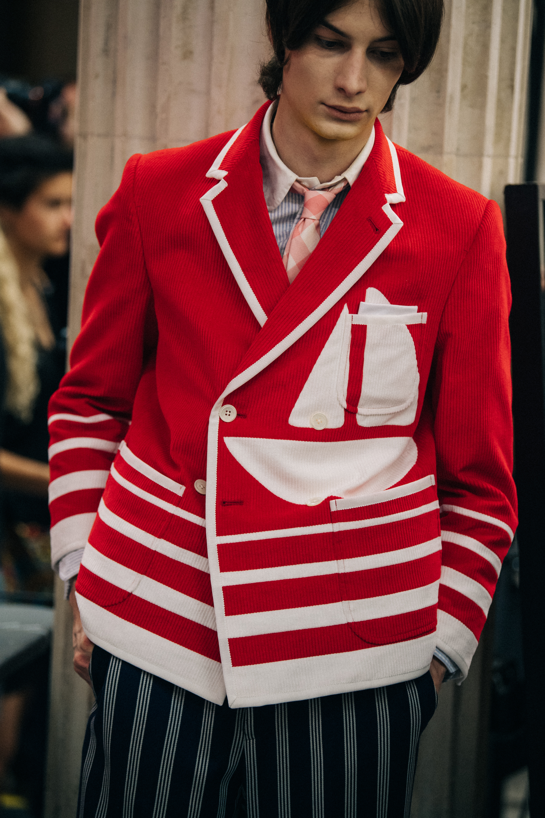 Model wearing red at Thom Browne