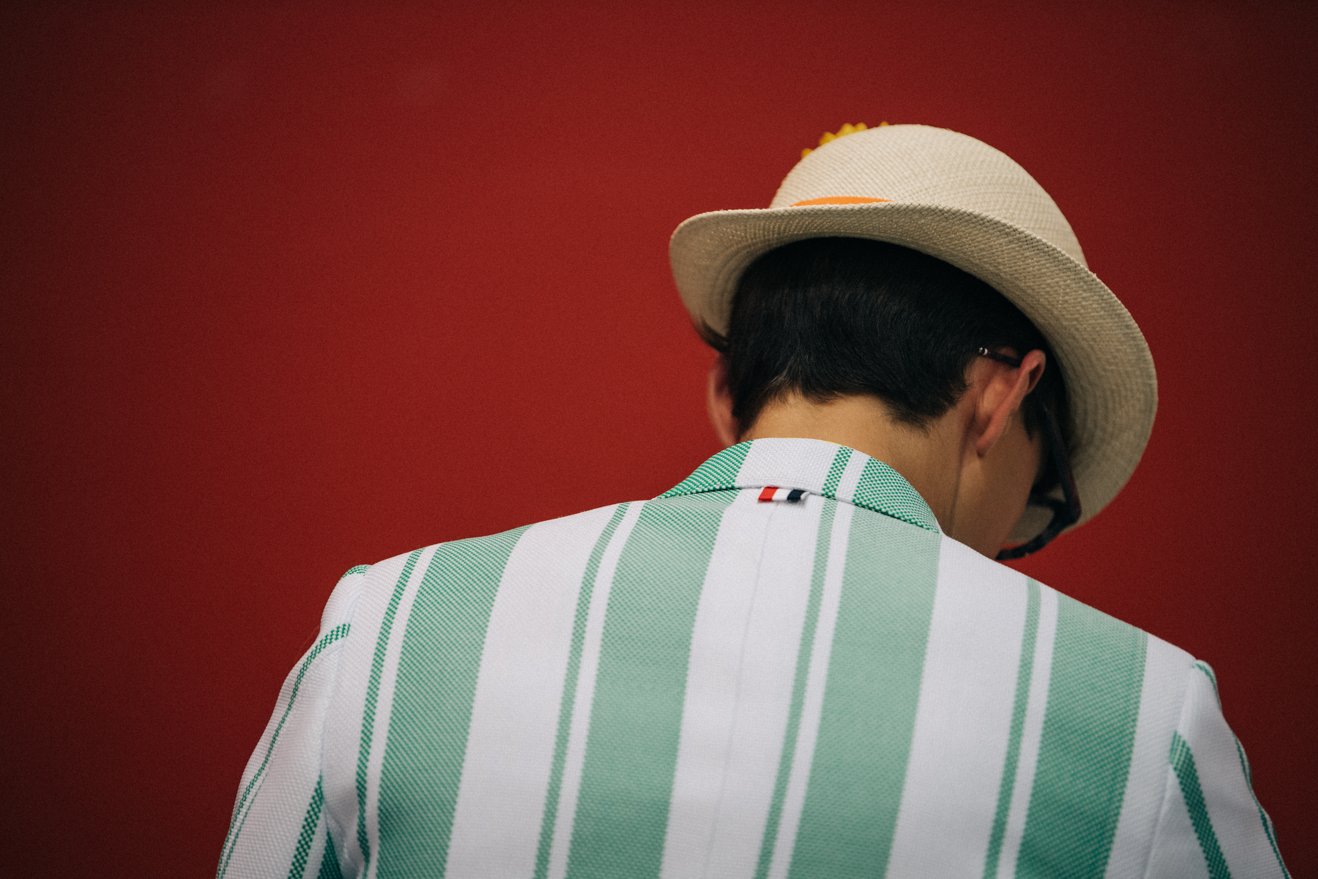 Model wearing green suit jacket