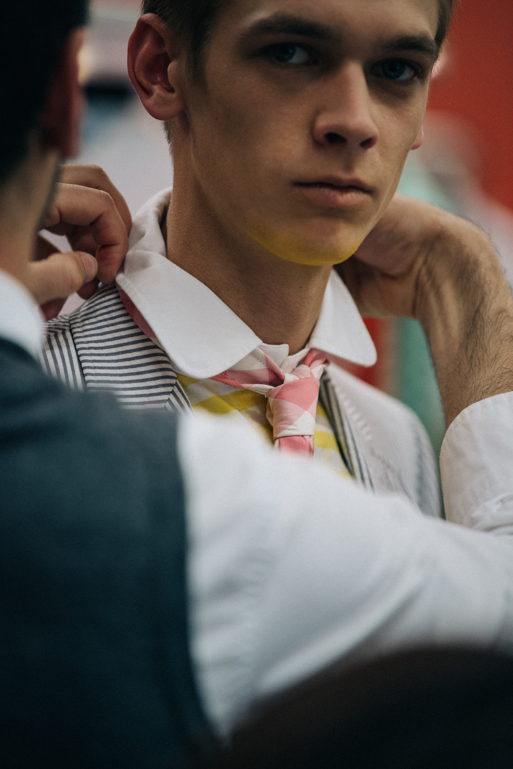 Model wearing pink tie at Thom Browne