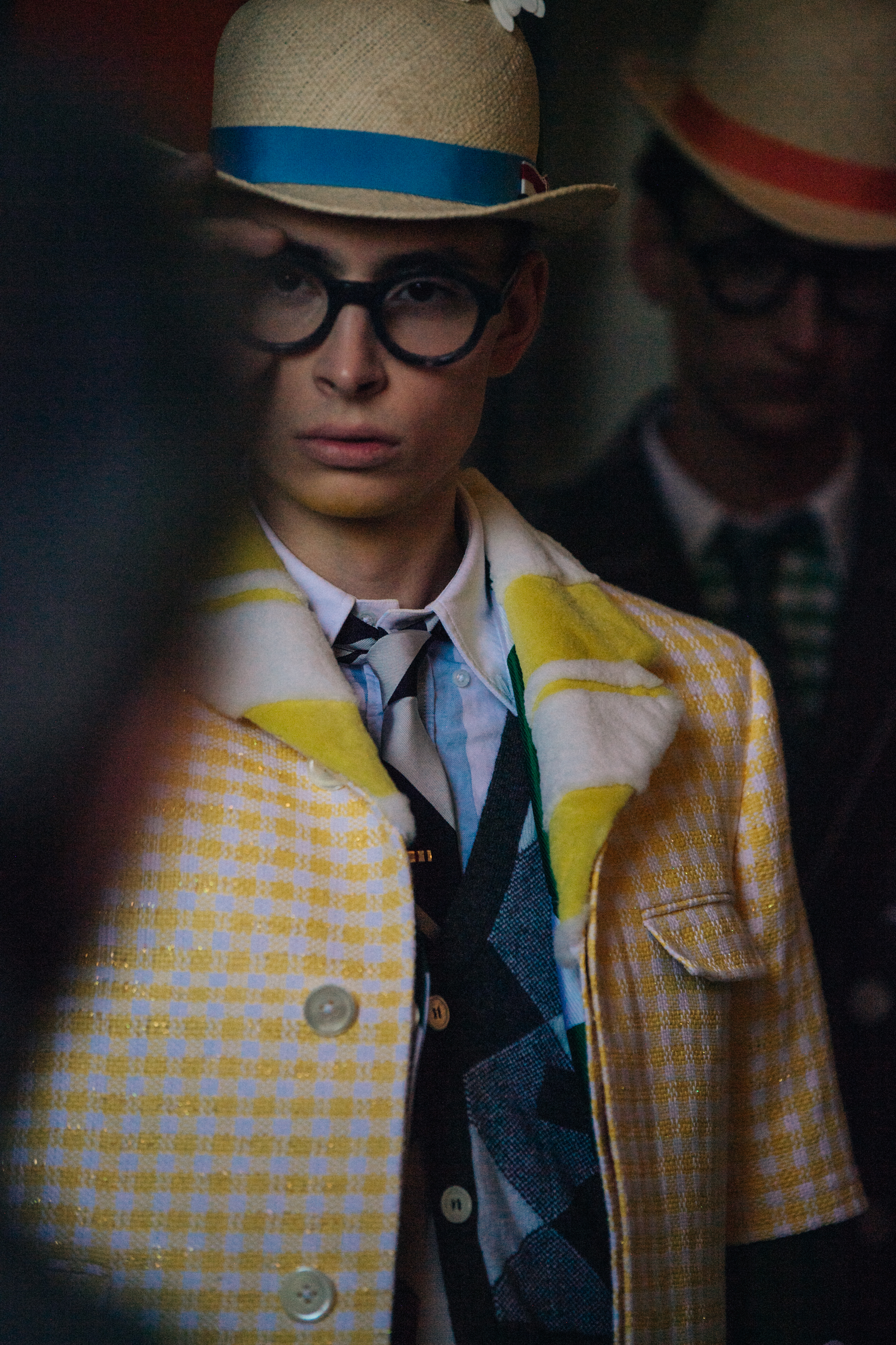 Model wearing colourful check at Thom Browne