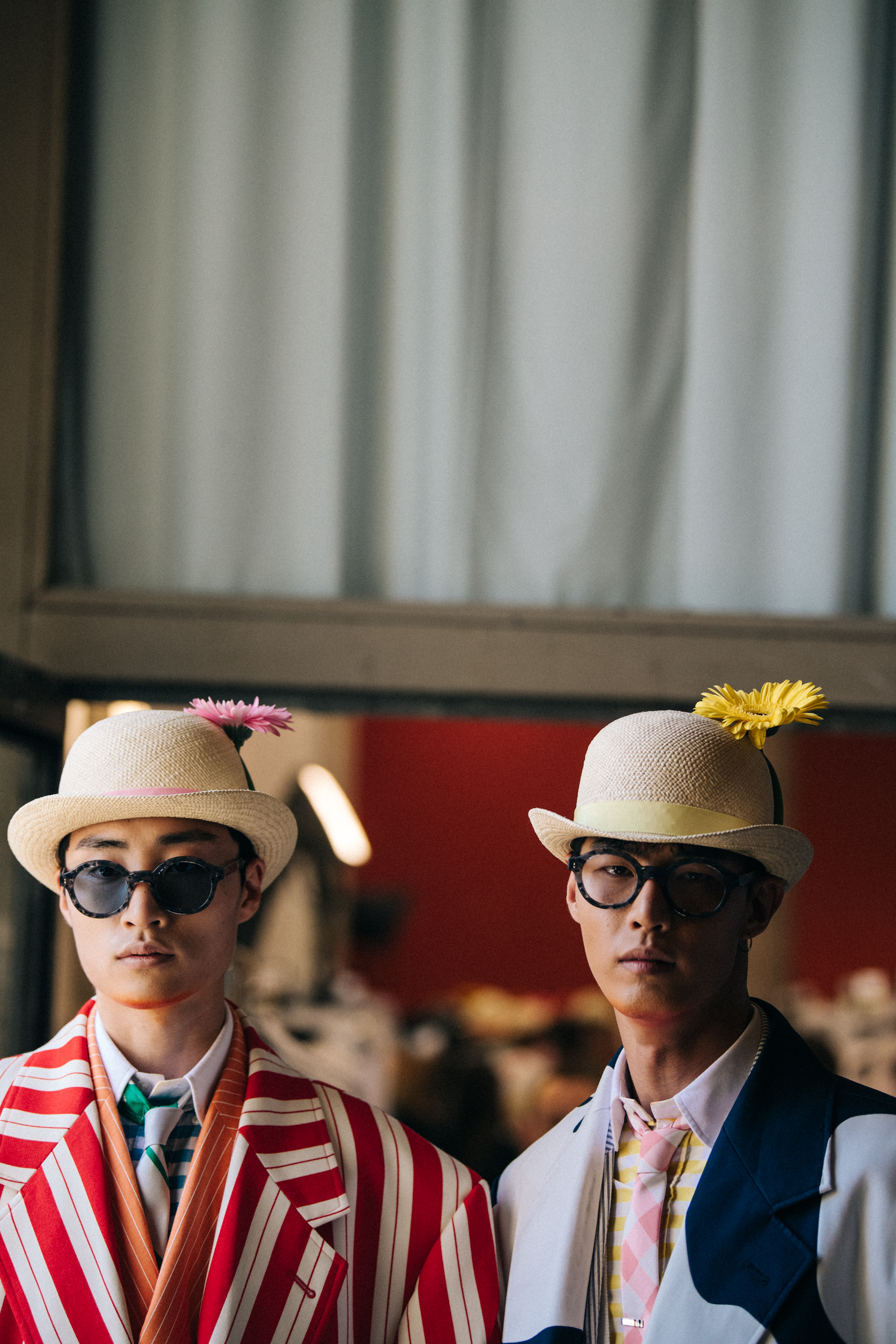 Models wearing red and blue suits