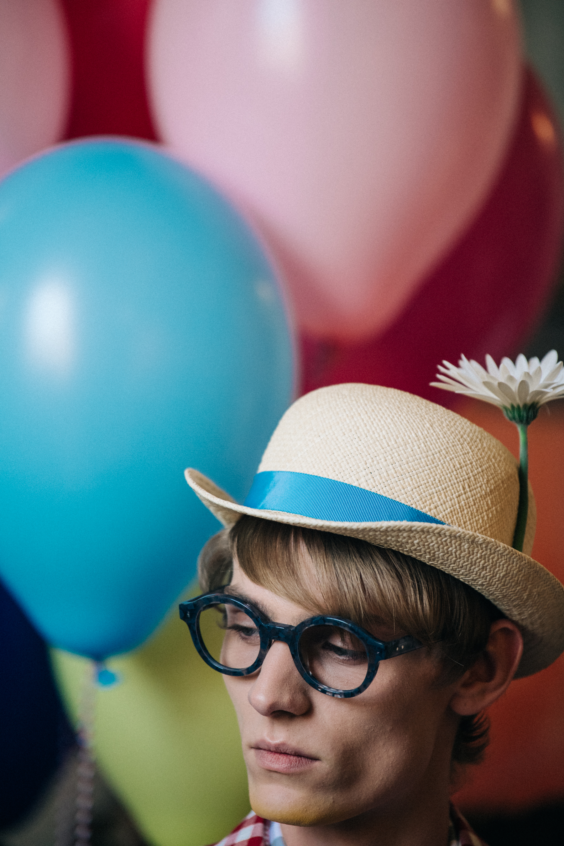 Models holding balloons at Thom Browne