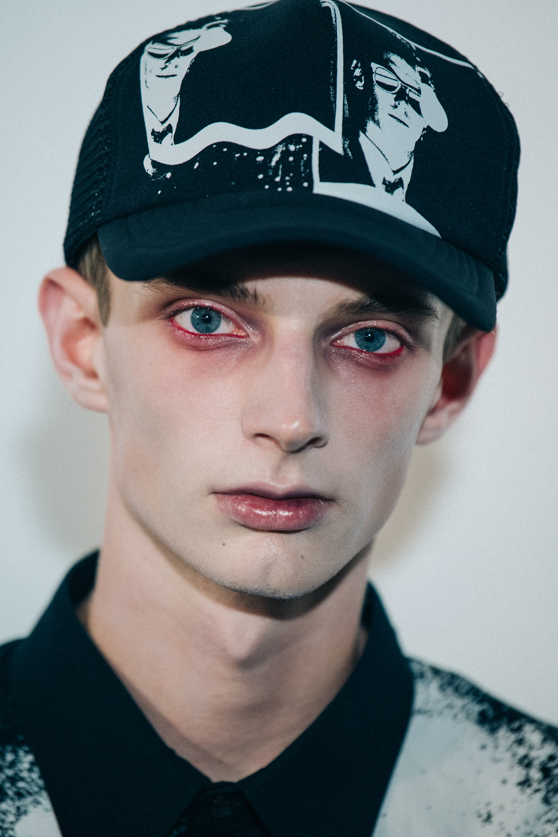 Portrait of model wearing cap at Undercover