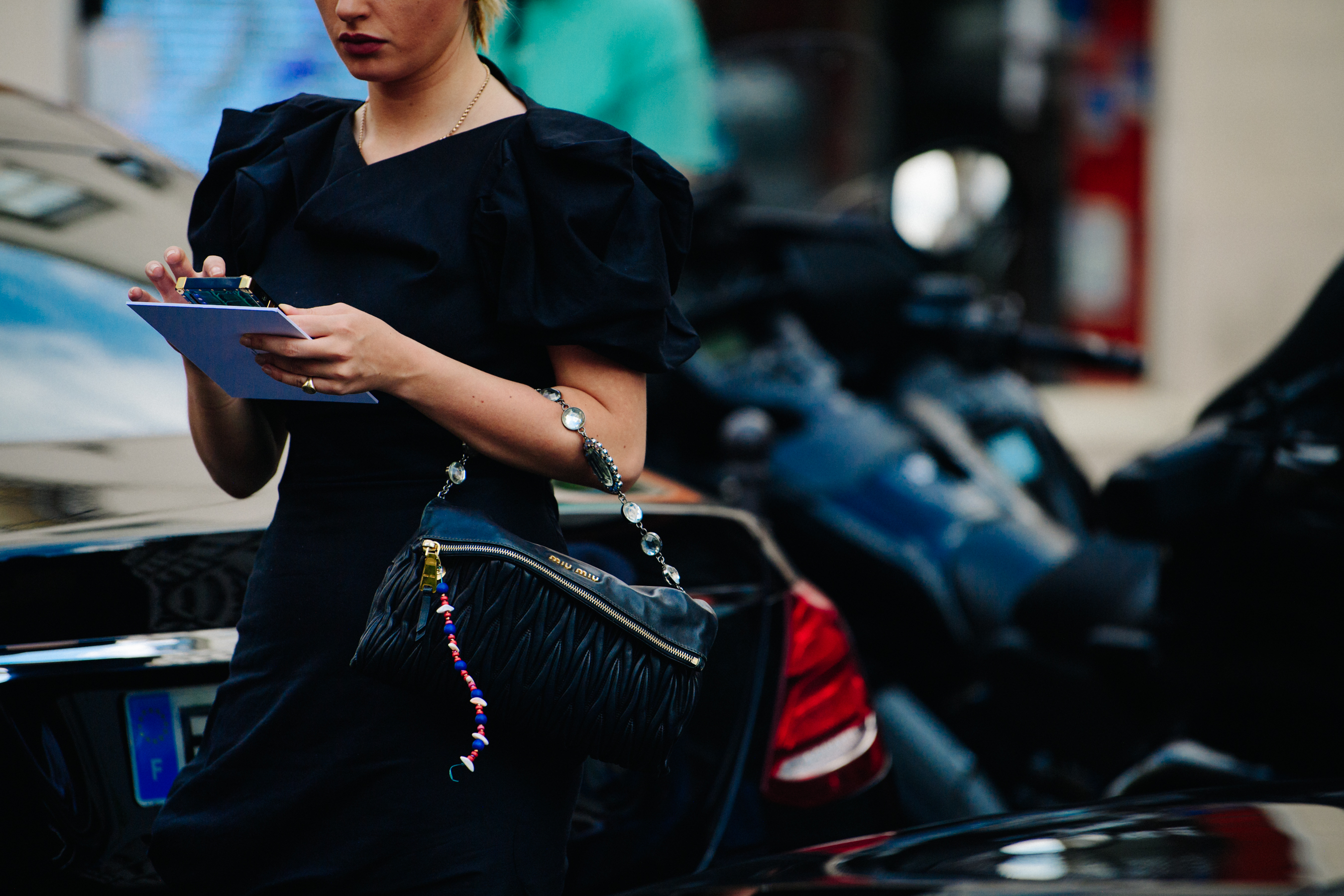 Woman carrying Miu Miu bag