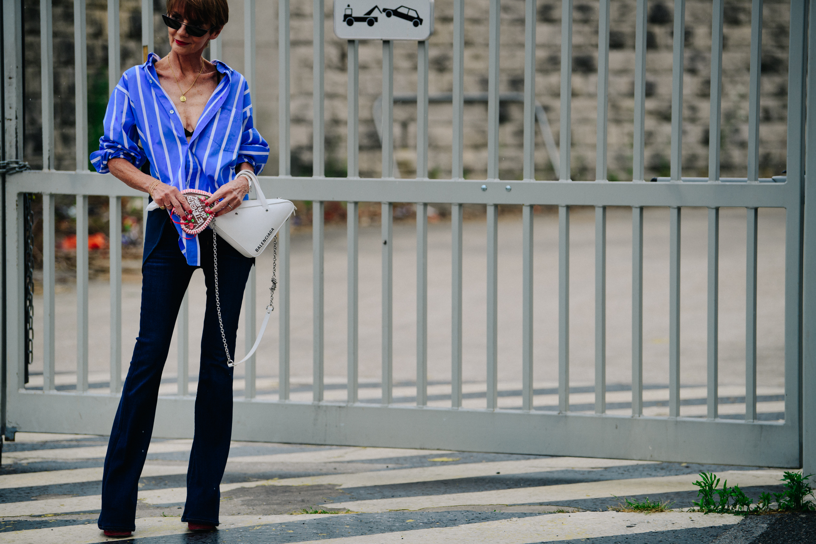Woman wearing blue striped shirt